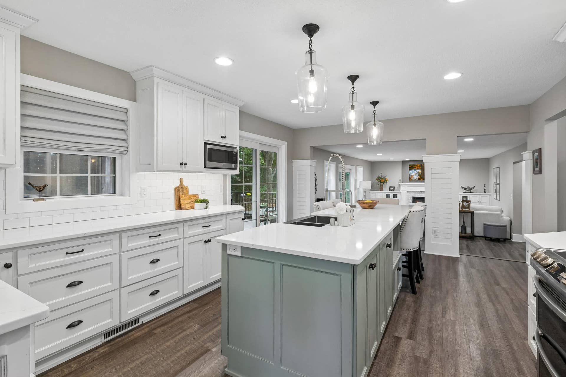 505 Severn Way, Eagan, MN 55123 Kitchen featuring custom two-tone cabinetry, generous storage, and a large center island.