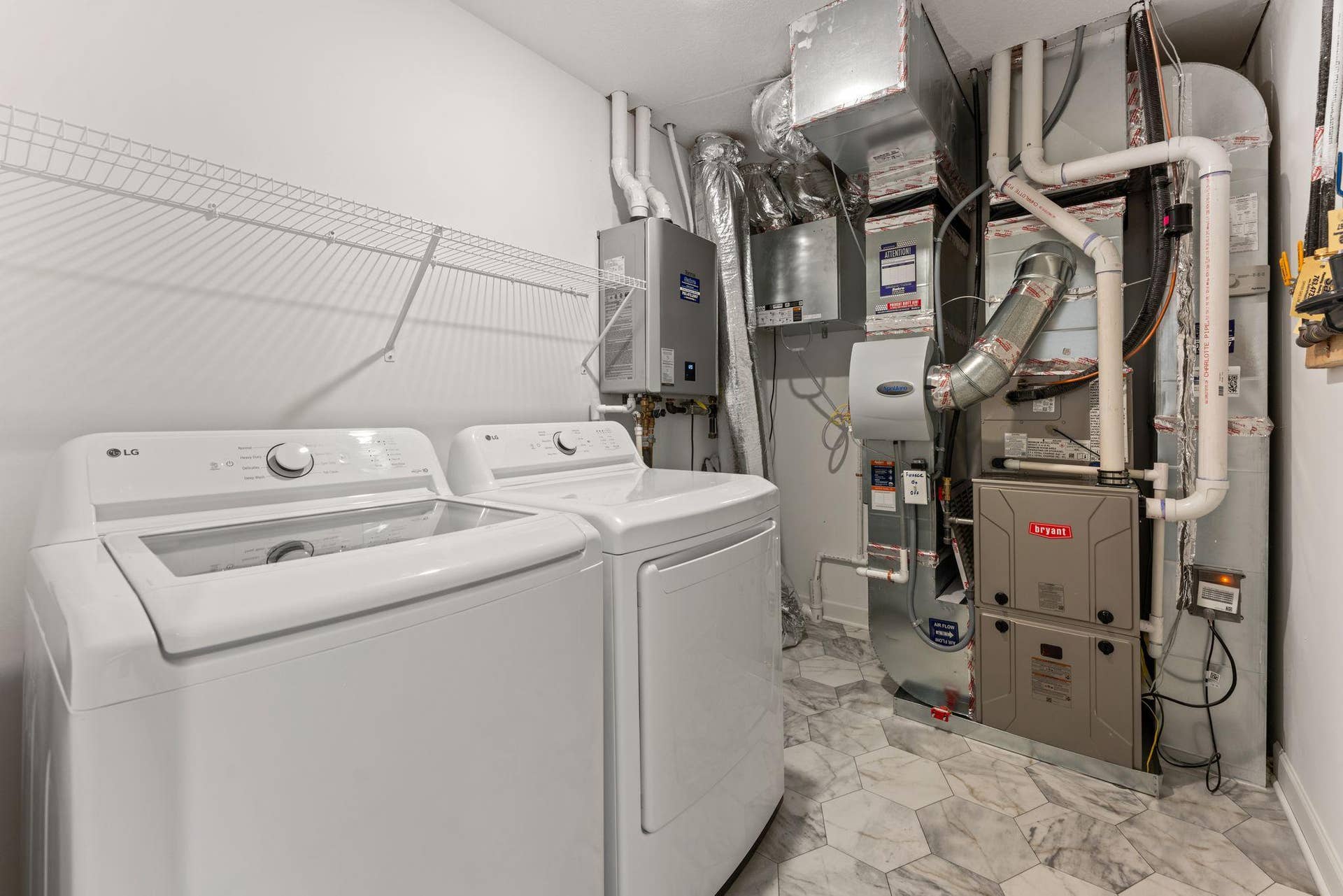 10564 Glacier Lane N, Maple Grove, MN 55369 (Photo of a similar home, actual finishes may vary) The laundry room features ventilated shelving for your storage needs