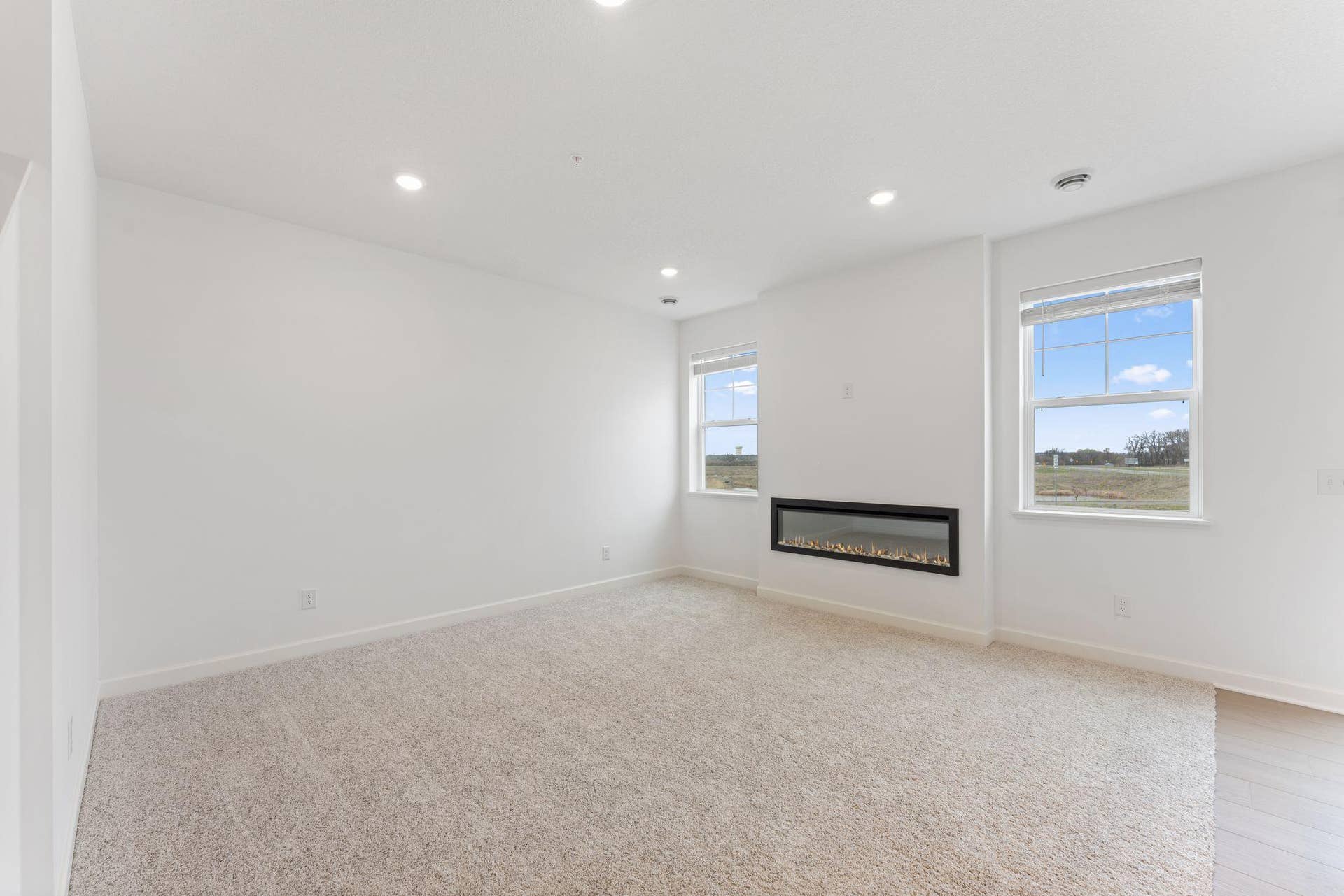 10564 Glacier Lane N, Maple Grove, MN 55369 (Photo of a similar home, actual finishes may vary) The natural gathering space of the home, the Great Room is excellent for hosting movie nights with loved ones with an electric fireplace to add a warm charm.