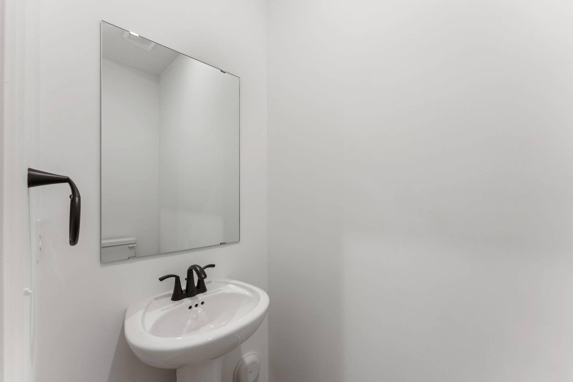 10564 Glacier Lane N, Maple Grove, MN 55369 (Photo of a similar home, actual finishes may vary) In a discreet location on the first floor is a convenient powder room to accommodate the needs of the whole household and visiting guests.