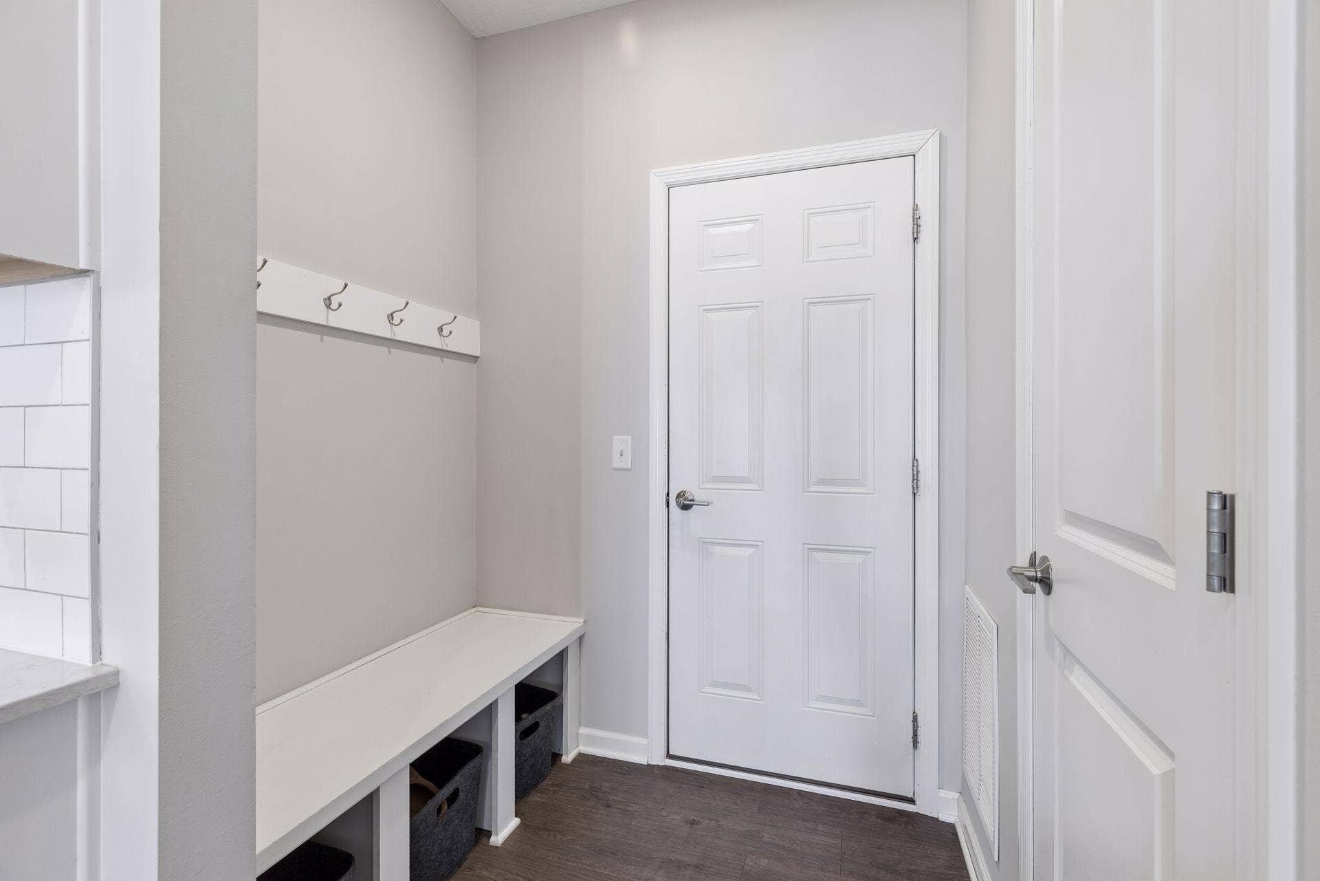 Mudroom with built-in hooks and storage space for coats, shoes, and everyday organization.