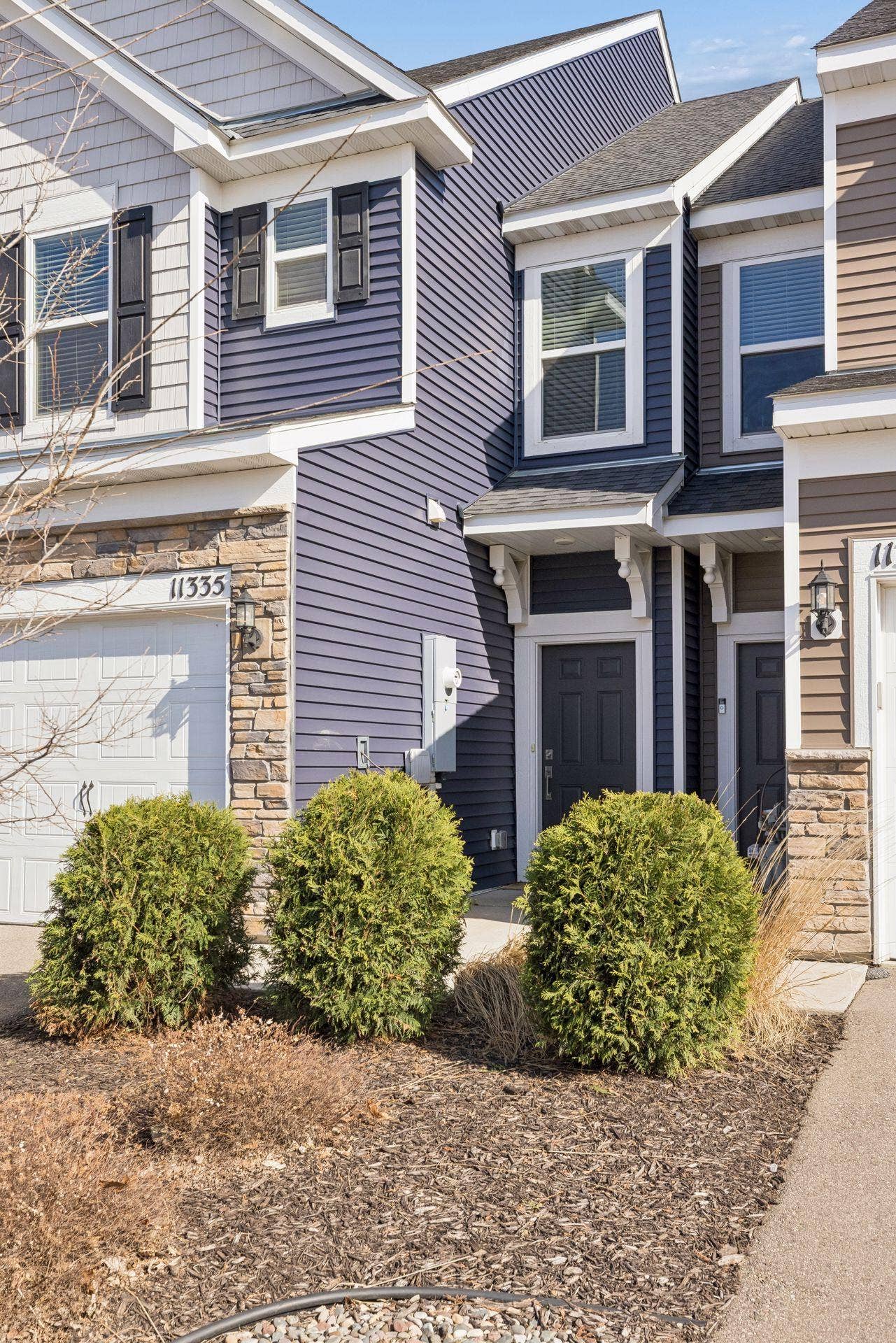 Approach to the front entrance with covered doorway and inviting curb appeal.