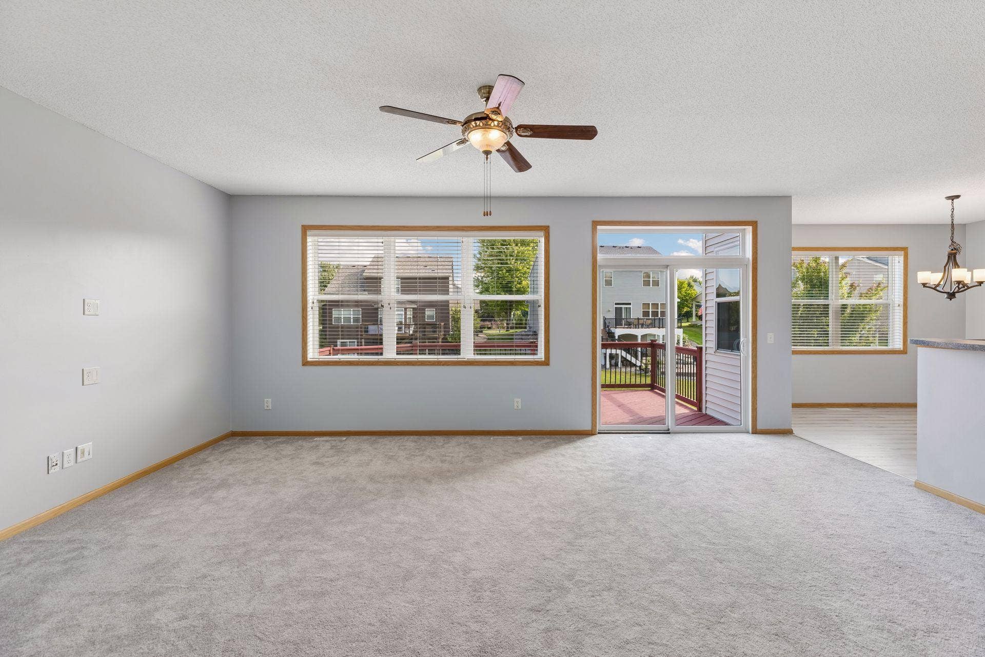 Spacious living room with large windows.