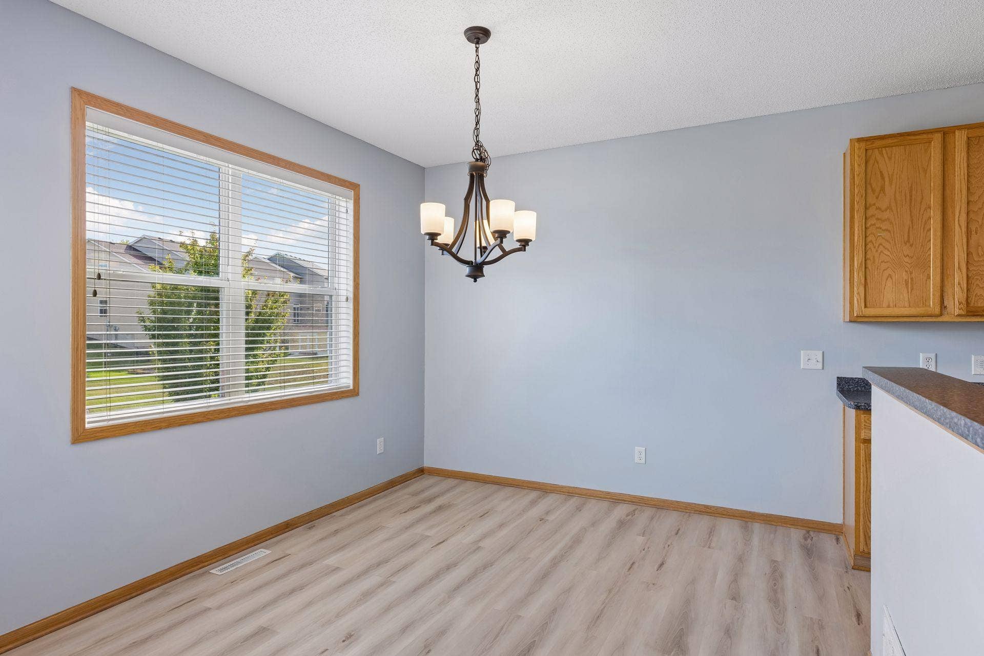 Sun-filled dining area with large window