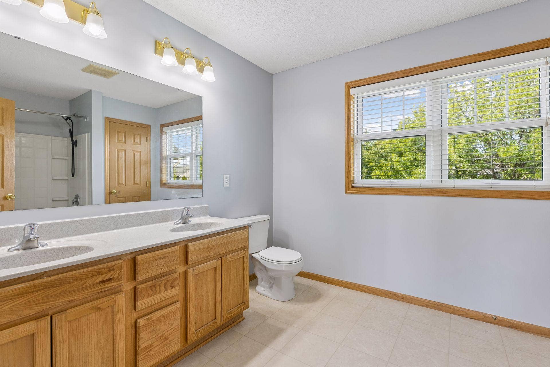 Primary bathroom featuring dual sinks