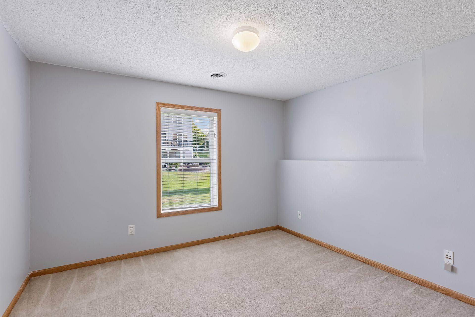 Lower level bedroom with natural light.