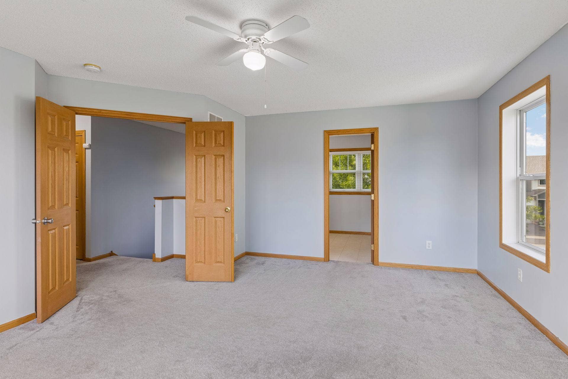Primary bedroom featuring generous space and french doors