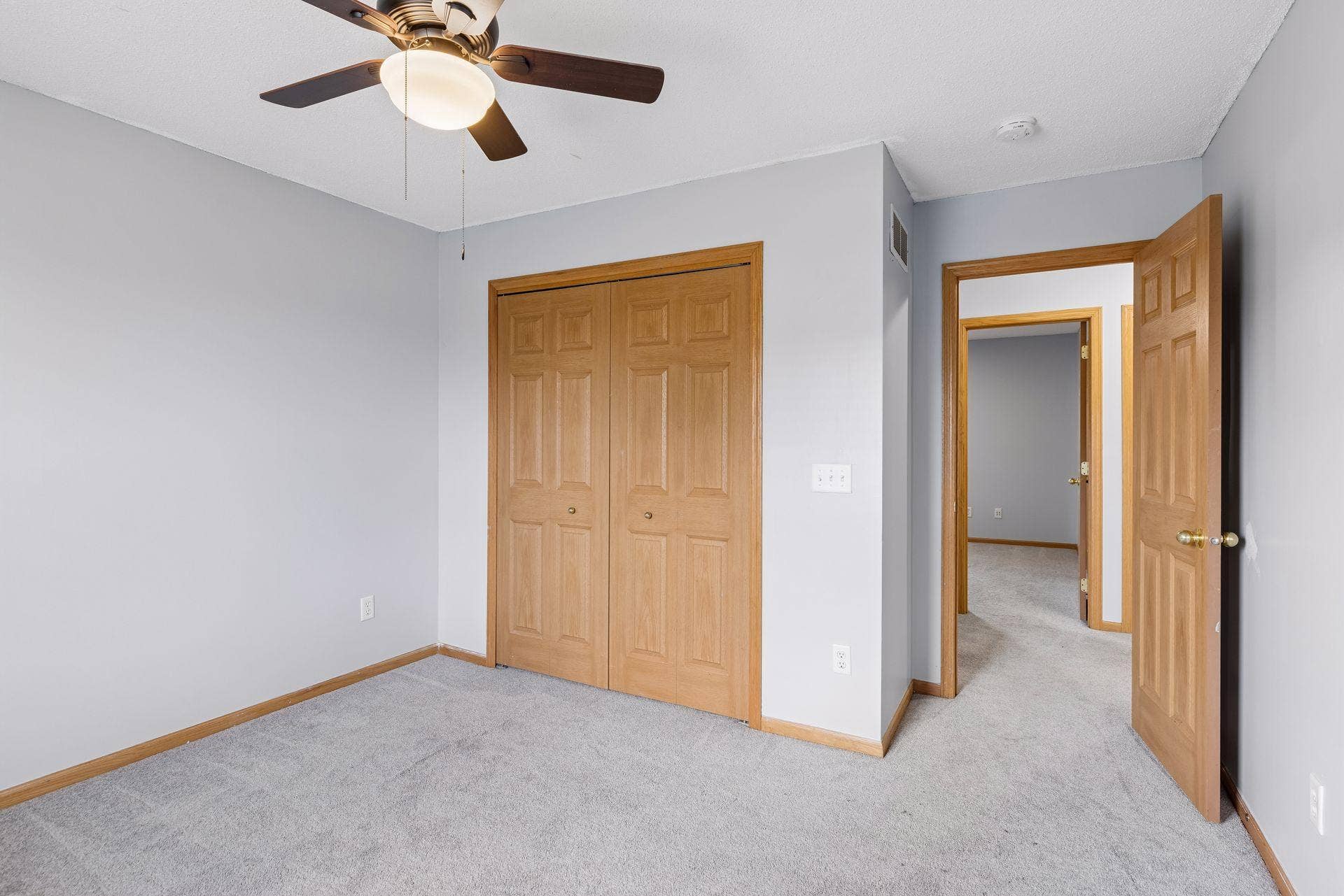 Bedroom featuring a spacious closet and convenient hall access