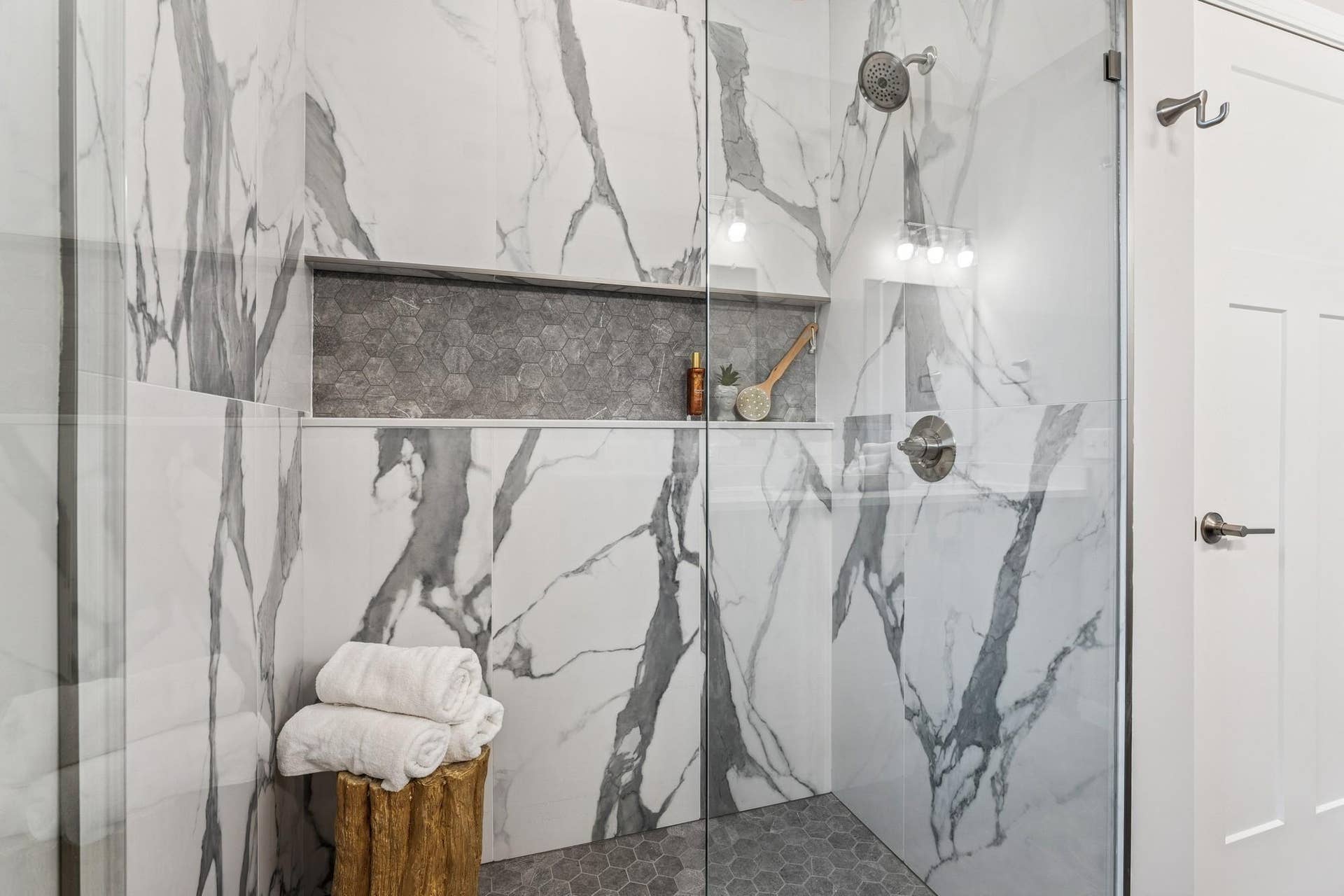 4907 Evergreen Drive N, Hugo, MN 55038 Amazing curb-less shower. Choose from glass or a half-wall. Pick your own tiles. Photos from similar home.