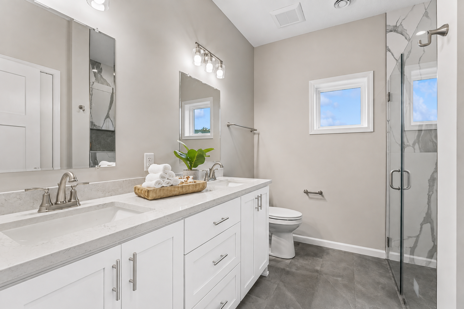 4907 Evergreen Drive N, Hugo, MN 55038 Ensuite with double sinks and curbless shower - Choose cabinet stain or go white! Choose your countertop - quartz or granite. Photos from similar home.