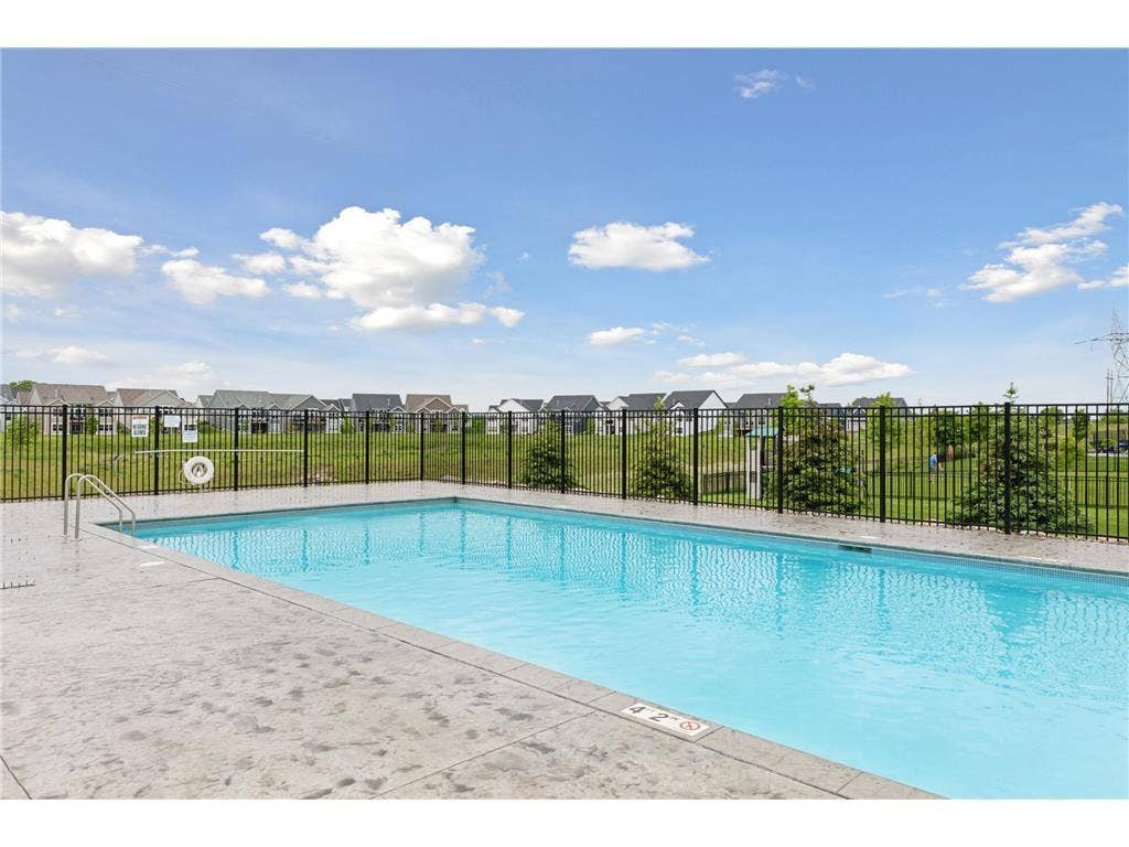 9960 Arrowwood Trail, Woodbury, MN 55129 This fully fenced and heated community pool is a standout Highcroft amenity, offering residents a safe and comfortable place to swim and relax.
