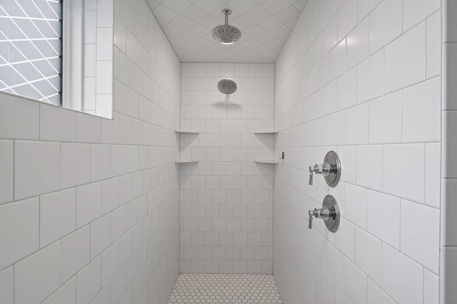 9960 Arrowwood Trail, Woodbury, MN 55129 A true spa-like escape; the fully tiled shower with dual shower heads brings luxury and relaxation to this owner's bathroom.