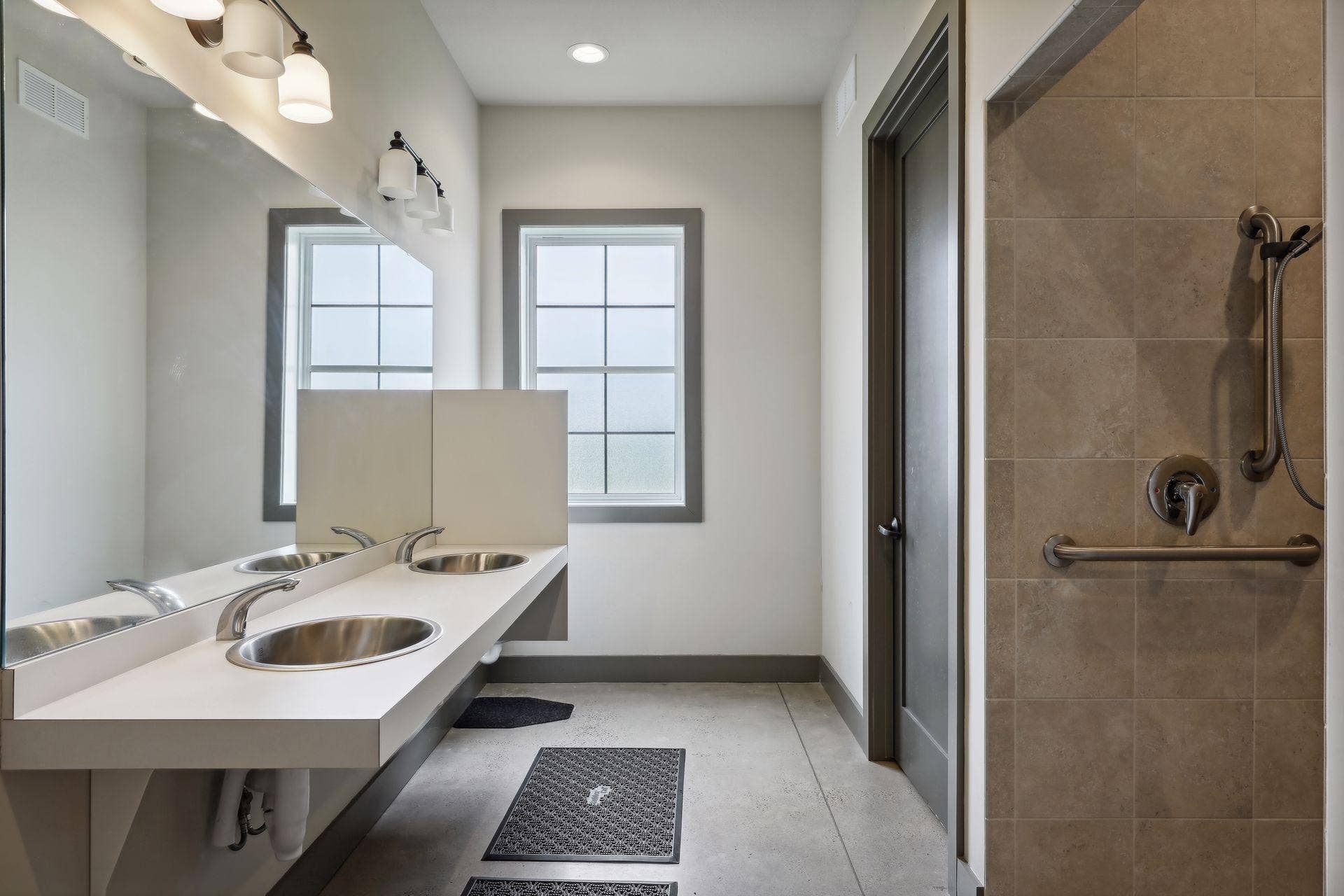 9960 Arrowwood Trail, Woodbury, MN 55129 Resident center's bathroom features a shower and toiletry area.