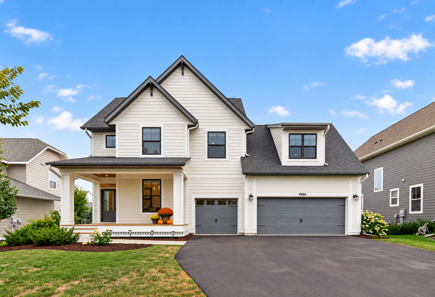 9960 Arrowwood Trail, Woodbury, MN 55129 Bold black windows and durable cement board siding create standout curb appeal. Enjoy Highcroft community amenities including a pool, fitness center, and clubhouse. Virtually staged with seasonal porch dcor.