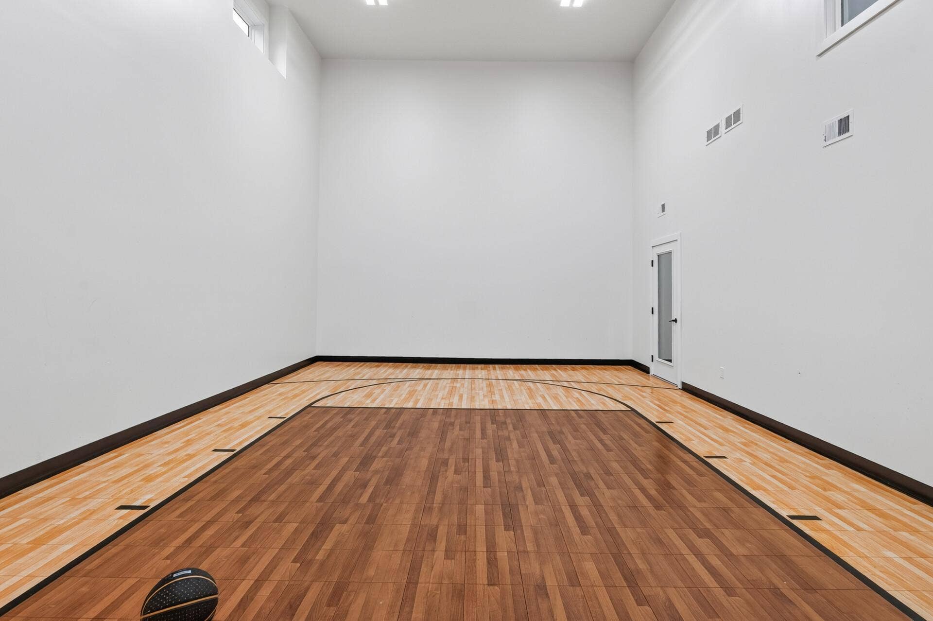 9960 Arrowwood Trail, Woodbury, MN 55129 A room for everyone! Play basketball, hockey shooting area, dance studio, weight room area, movie cinema, golf simulator or a pickleball court! The options are endless!