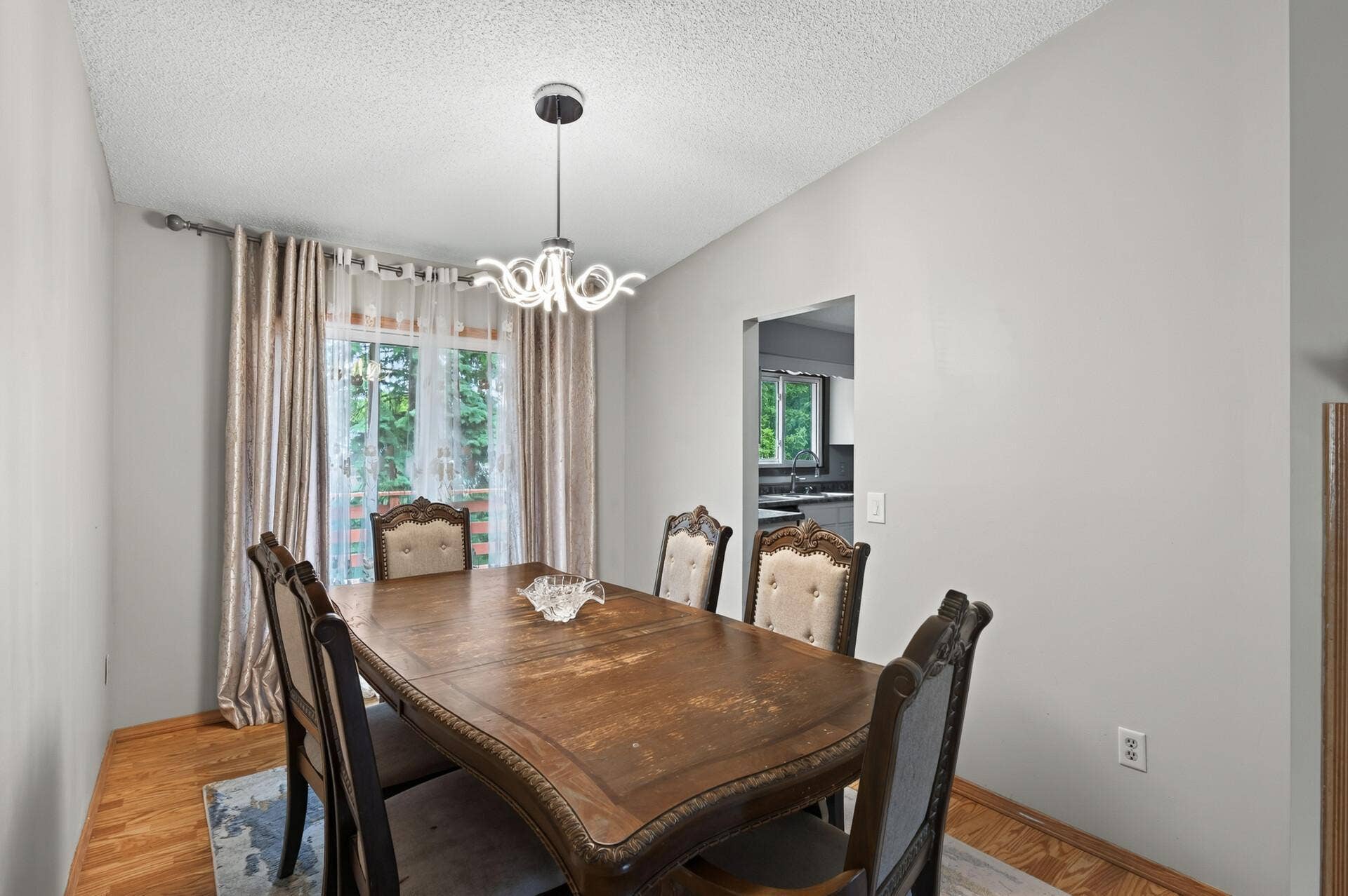 1124 Meadowwood Drive, Brooklyn Park, MN 55444 Dining room with sliding door access to the deck and rear yard.