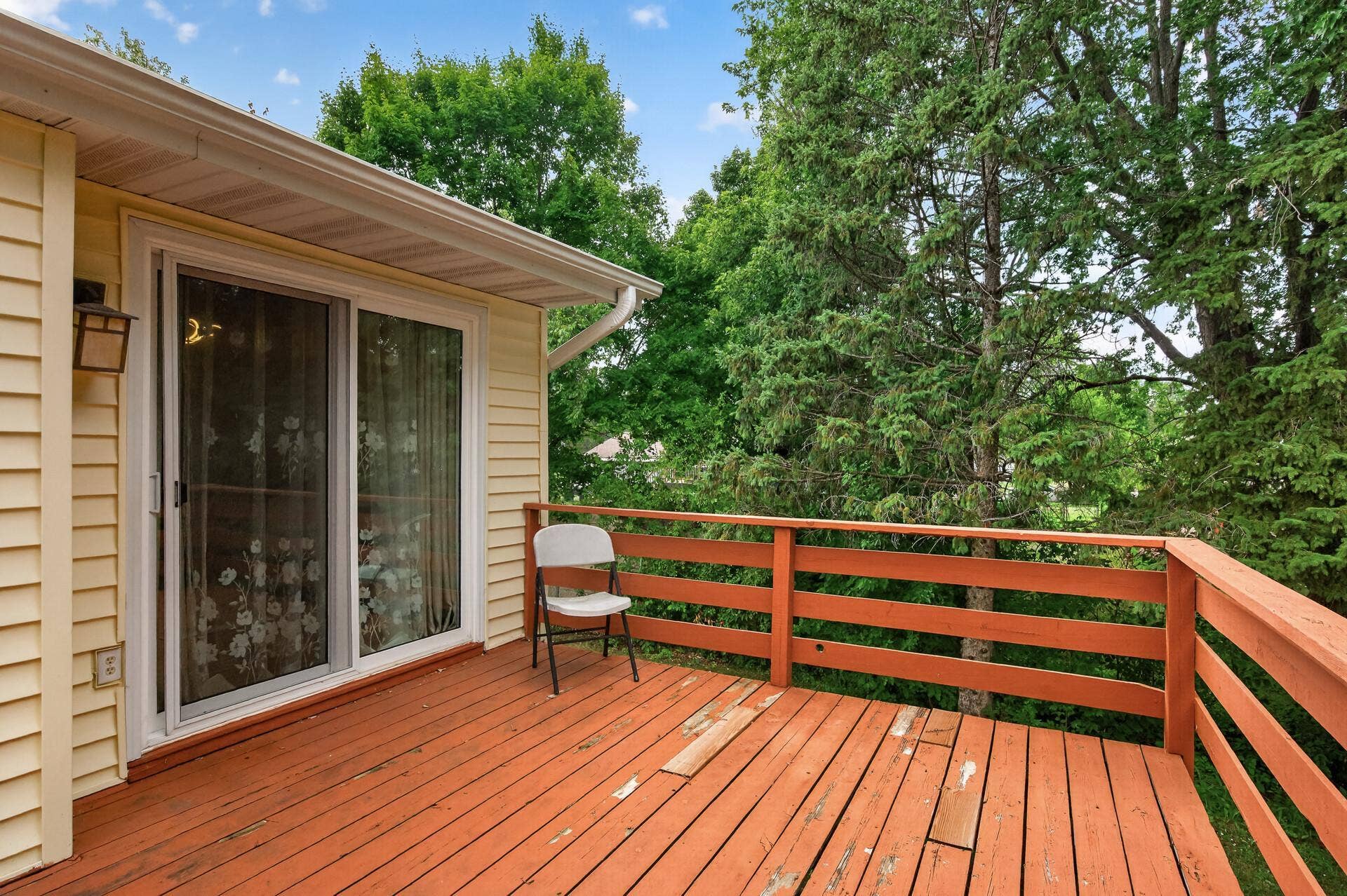 1124 Meadowwood Drive, Brooklyn Park, MN 55444 Mature trees add privacy to the yard.