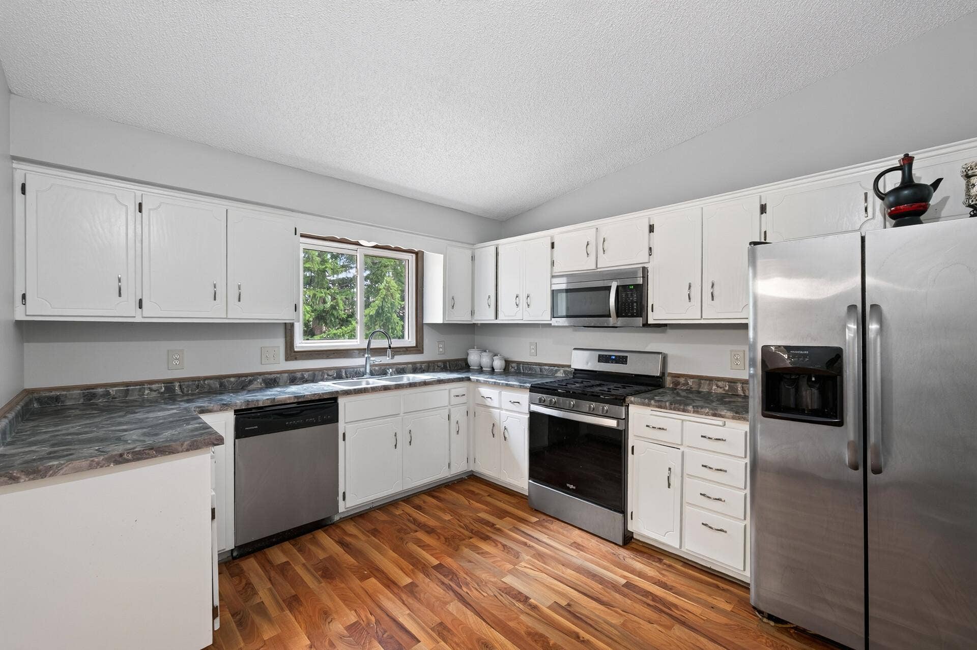 1124 Meadowwood Drive, Brooklyn Park, MN 55444 Kitchen with stainless steel appliances.