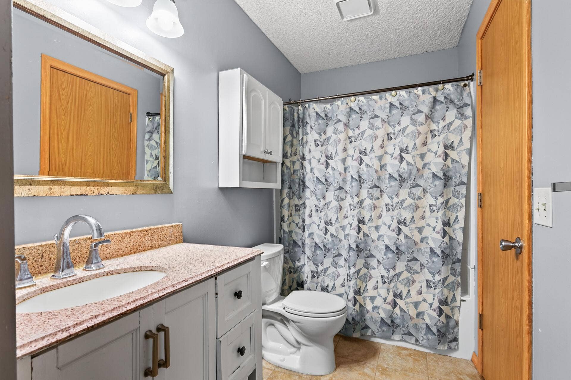 1124 Meadowwood Drive, Brooklyn Park, MN 55444 One of two full bathrooms
