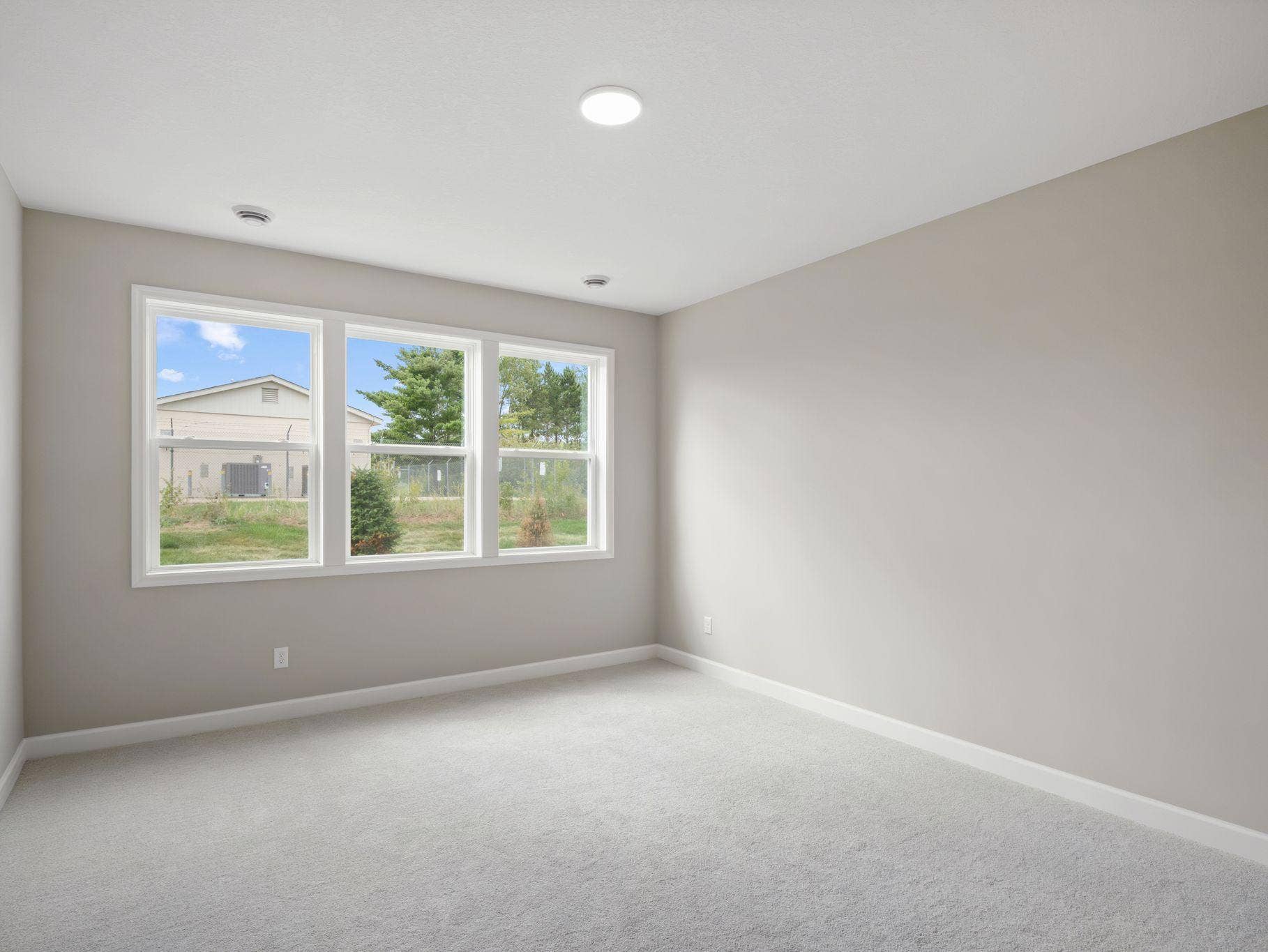 An owners suite sits in a rear corner of the home and is a relaxing oasis with an en-suite bathroom and walk-in closet.
