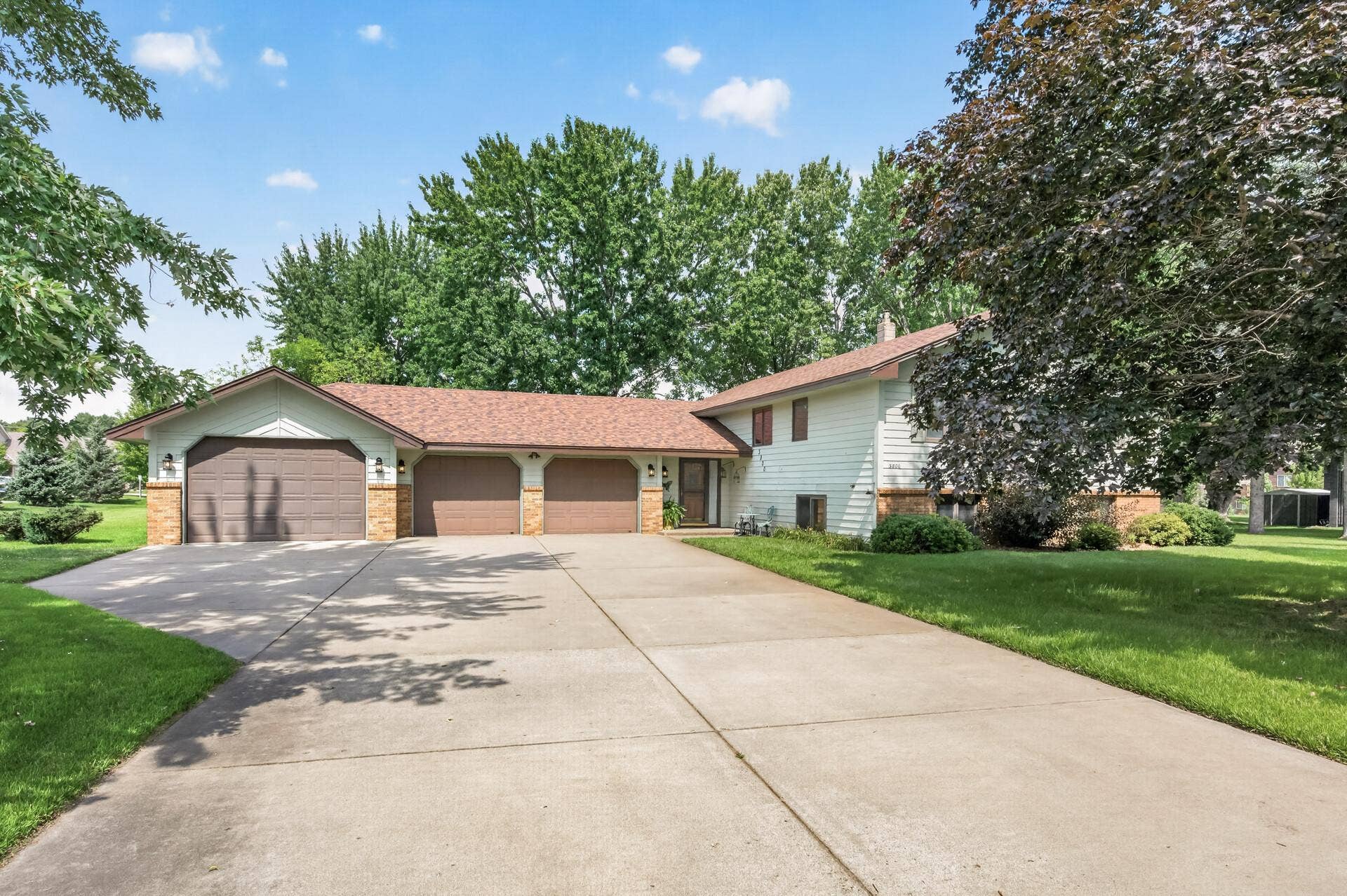 3800 101st Avenue N, Brooklyn Park, MN 55443 Huge concrete driveway for lots of parking and a desirable tandem 4 car garage for storing that extra car, boat, snowmobiles or side by side.