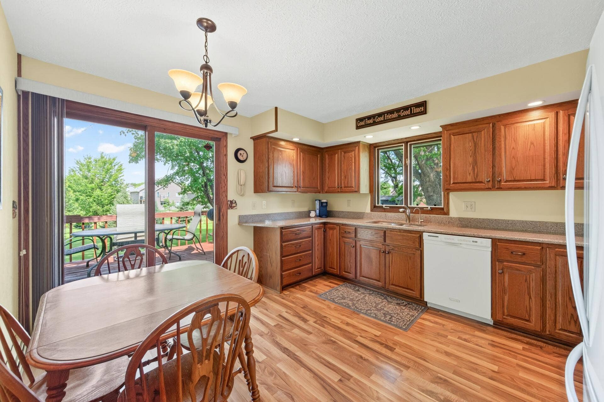 3800 101st Avenue N, Brooklyn Park, MN 55443 Nice kitchen with lots of oak cabinetry that offers an informal dining space. There is a sliding glass door that walks out to a deck in the backyard.