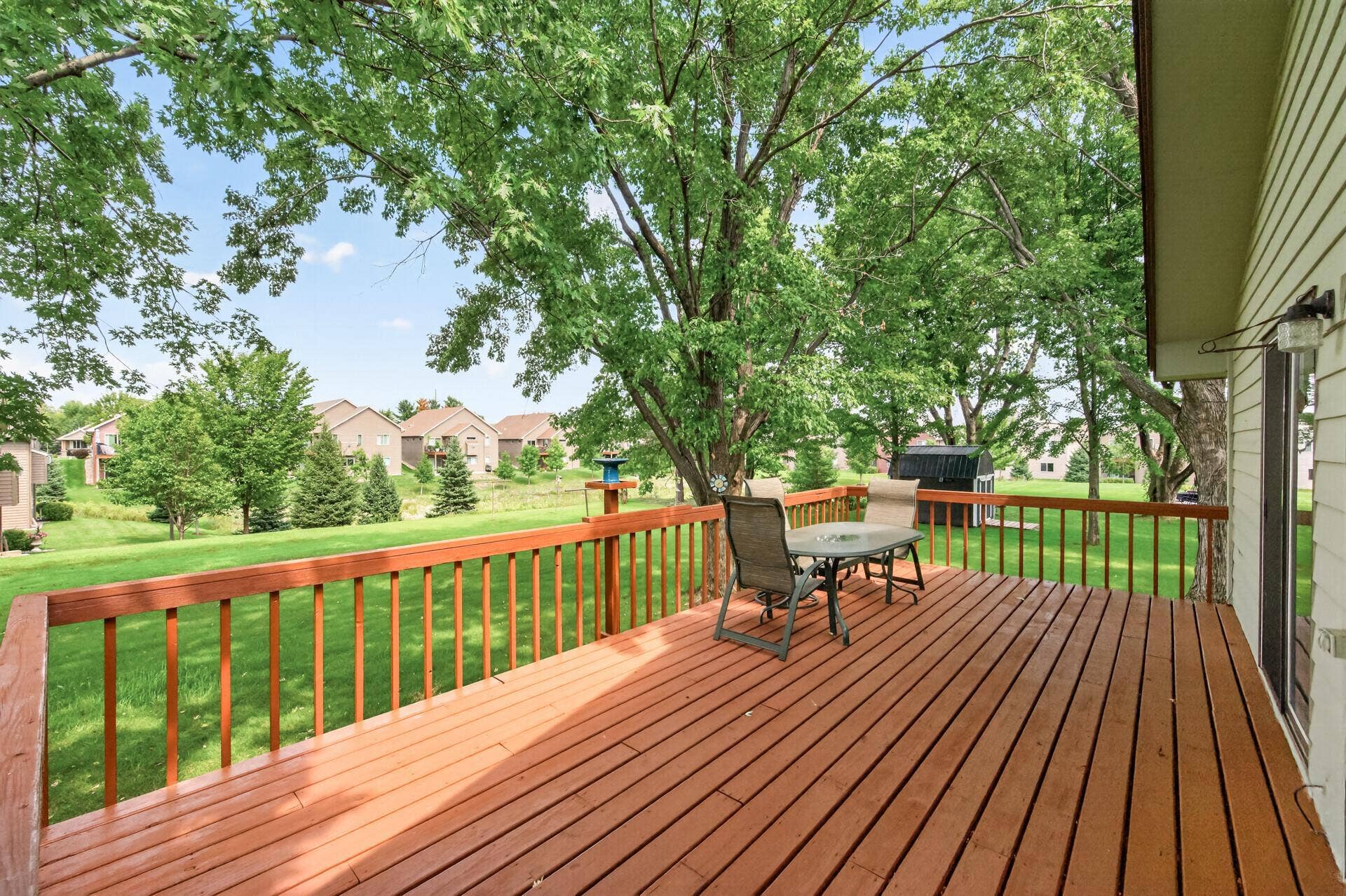 3800 101st Avenue N, Brooklyn Park, MN 55443 24x12 wood deck overlooking a beautiful backyard and lots of green space.