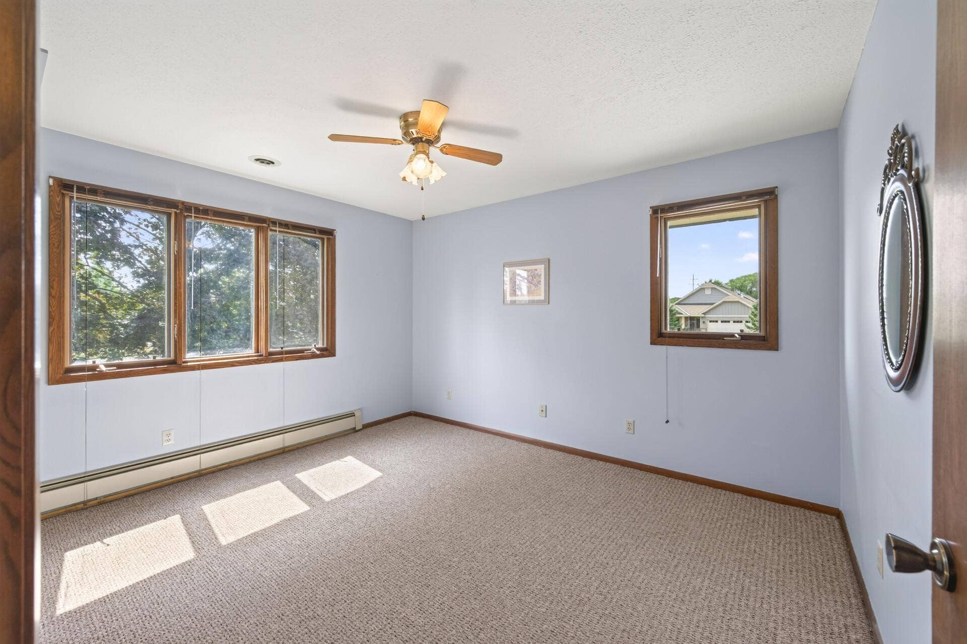 3800 101st Avenue N, Brooklyn Park, MN 55443 Bedroom # 3 on the upper level with a ceiling fan.
