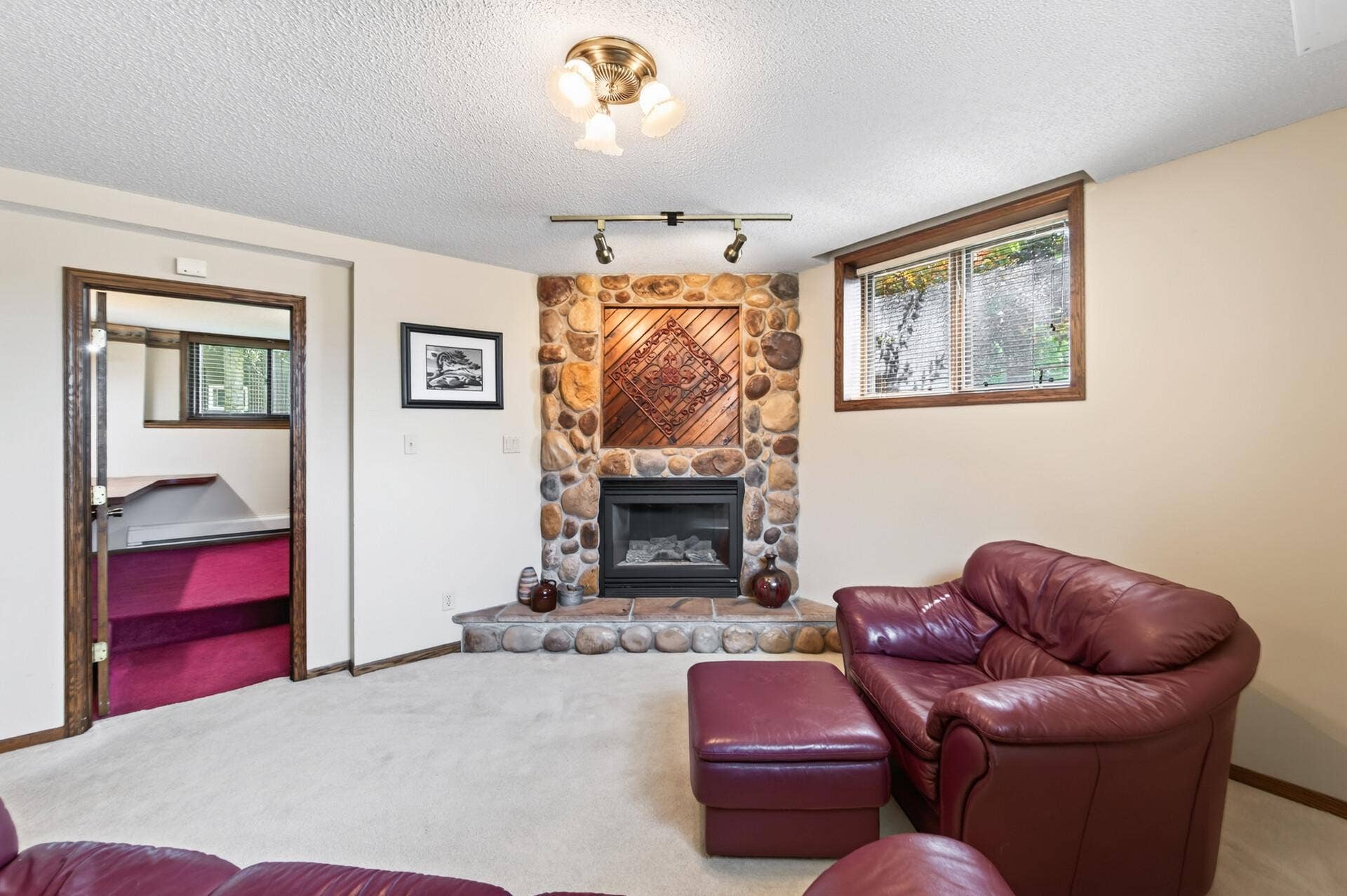 3800 101st Avenue N, Brooklyn Park, MN 55443 Beautiful gas fireplace with stone facade and hearth.