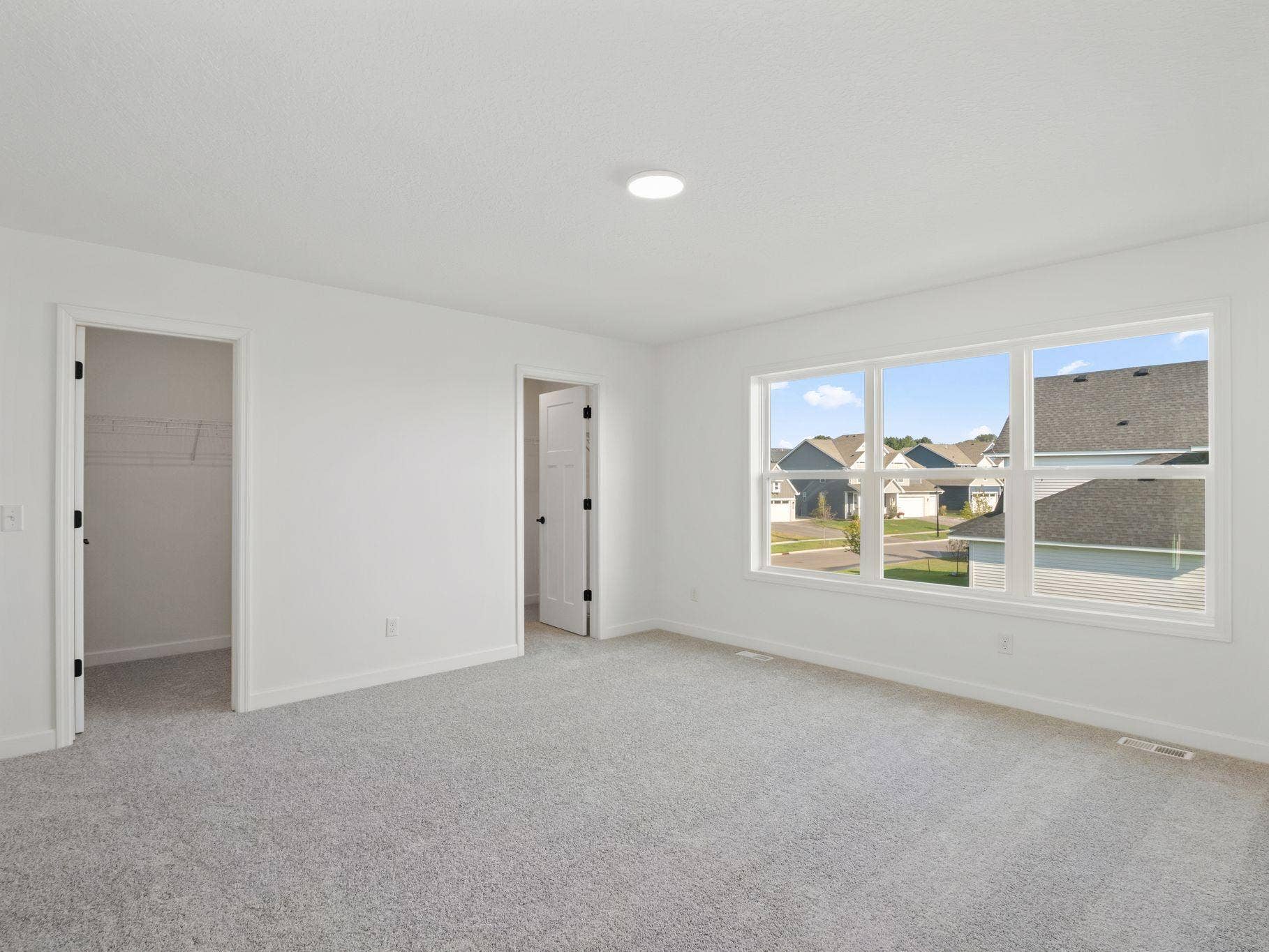 The expansive owners suite is located on the second level, complete with a restful bedroom, an en-suite bathroom and two walk-in closets.