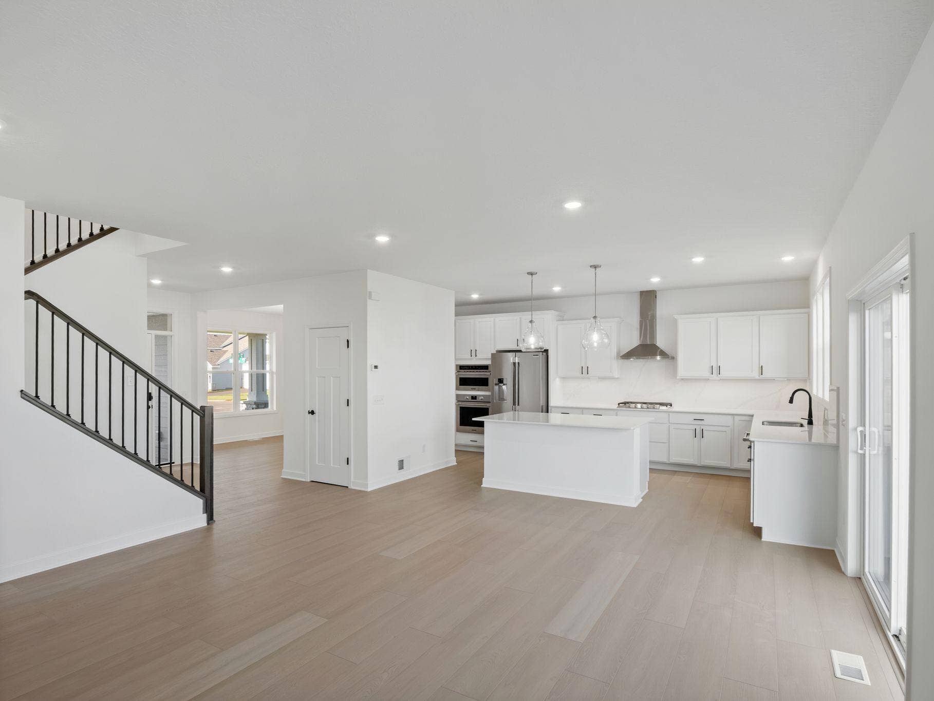 The breakfast room provides a convenient spot for casual meals and friendly conversations between the kitchen and family room.