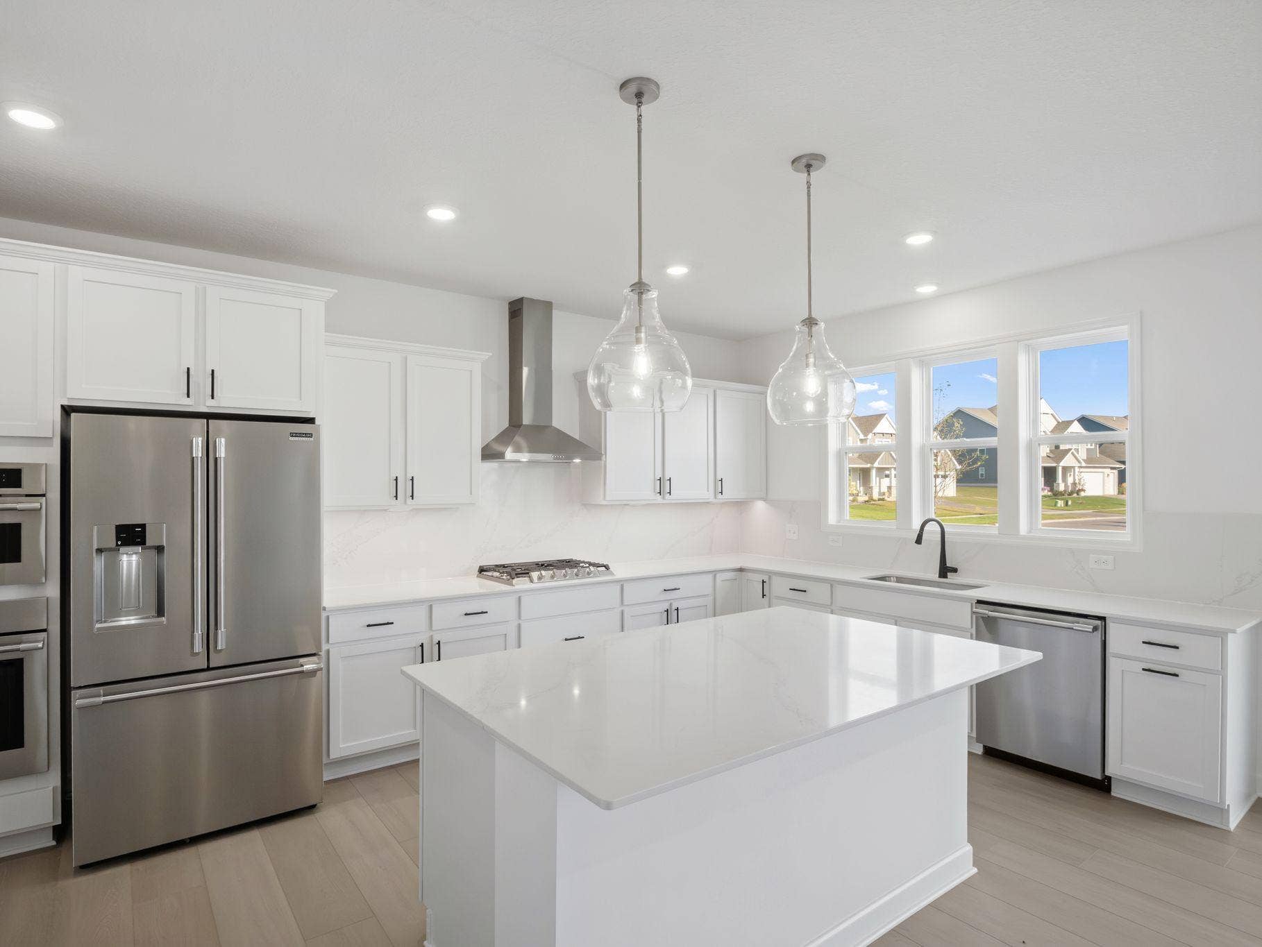 The spacious kitchen naturally serves as the heart of this home, complete with a generous center island, brand-new appliances and a walk-in pantry.