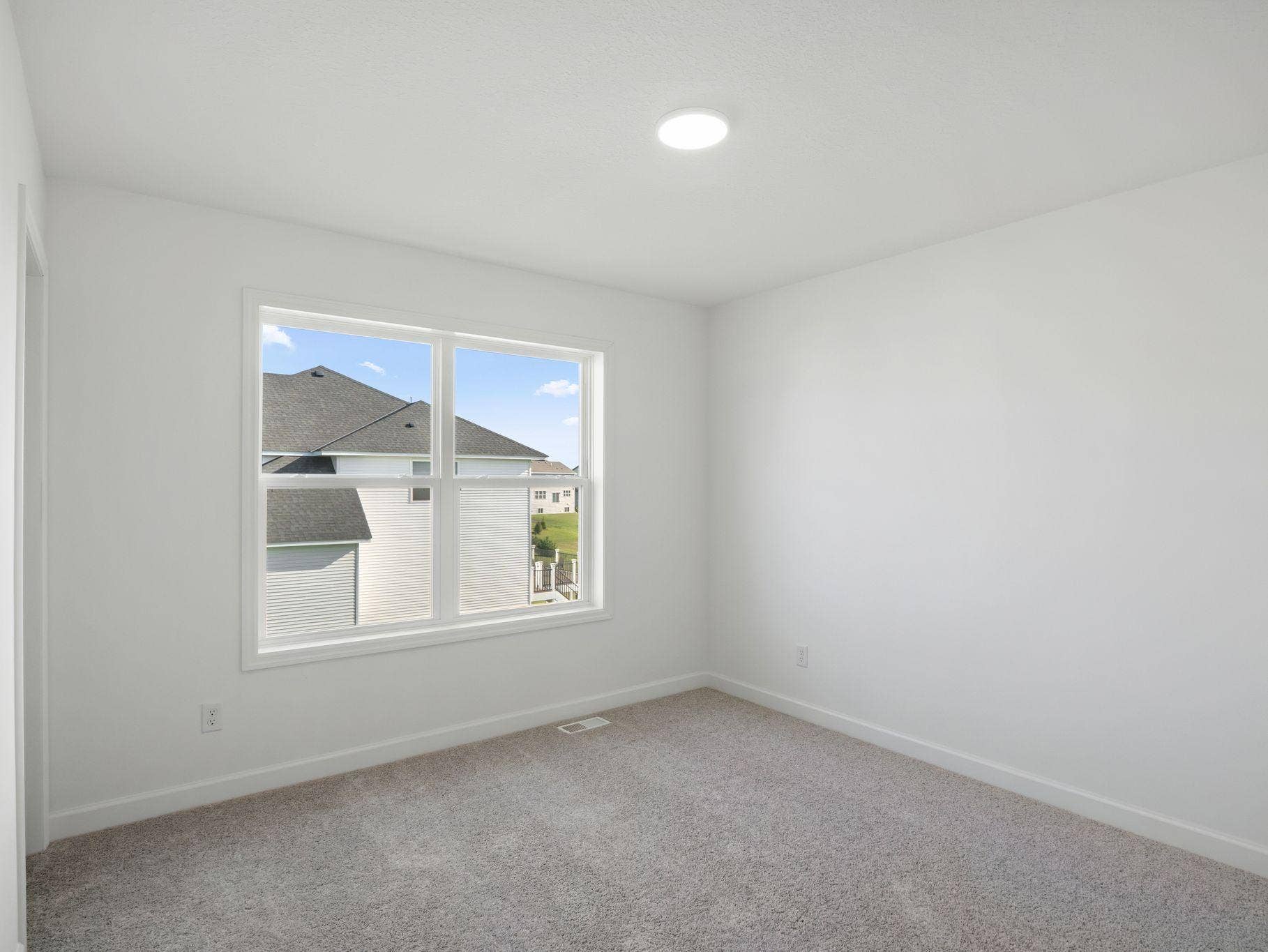 Three secondary bedrooms are located on the second floor.