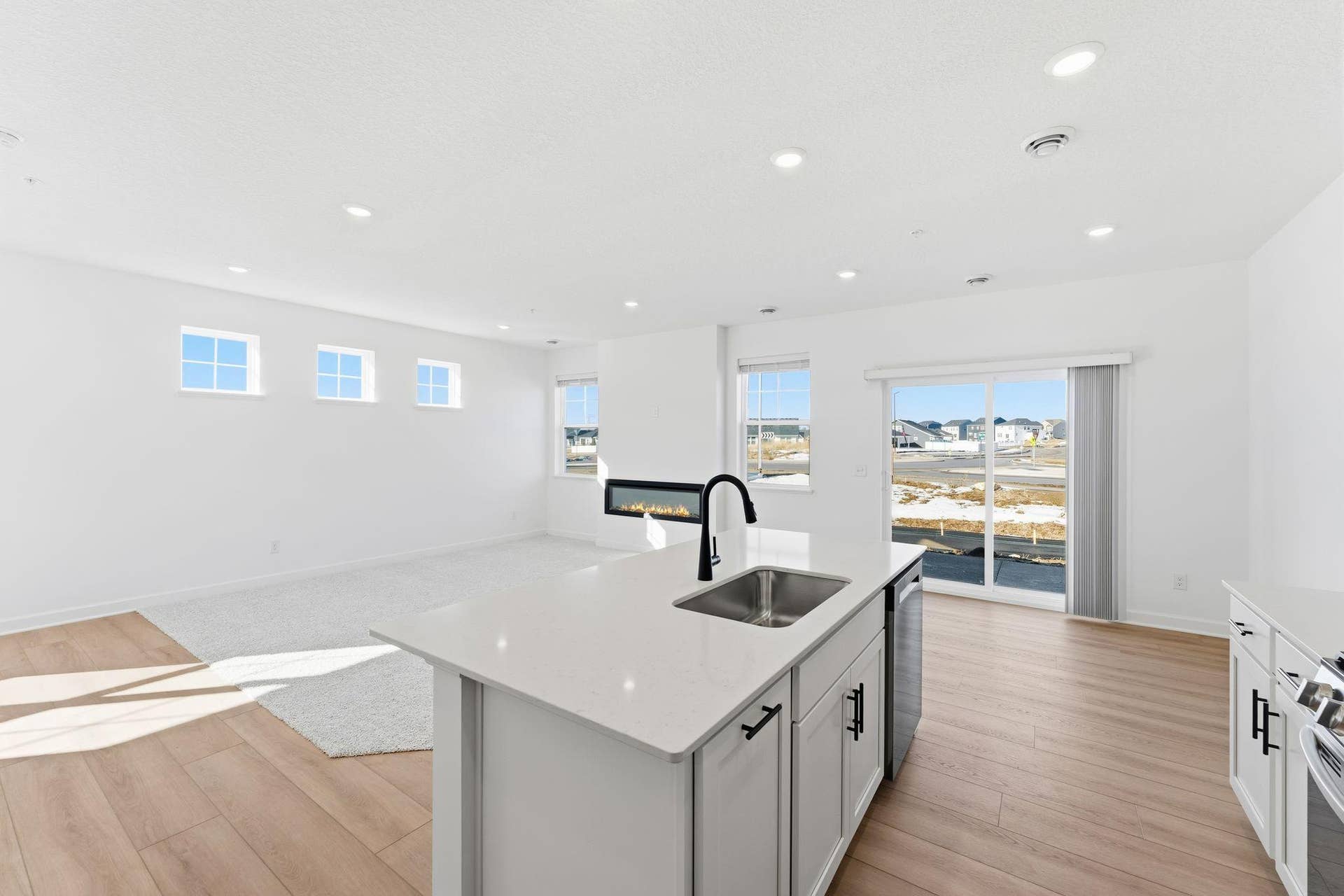 10551 Harbor Lane N, Maple Grove, MN 55369 (Photo of a similar home, actual finishes may vary) This center island includes a stainless steel sink with designer faucet to remove stubborn stains