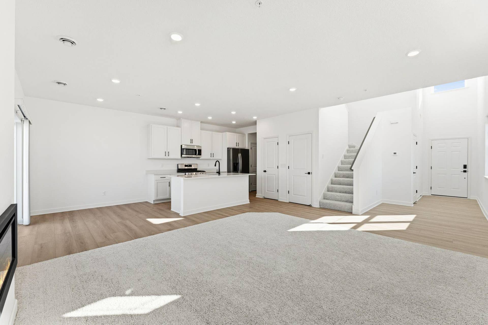 10551 Harbor Lane N, Maple Grove, MN 55369 (Photo of a similar home, actual finishes may vary) This Great Room is framed by windows to bathe the space in natural light