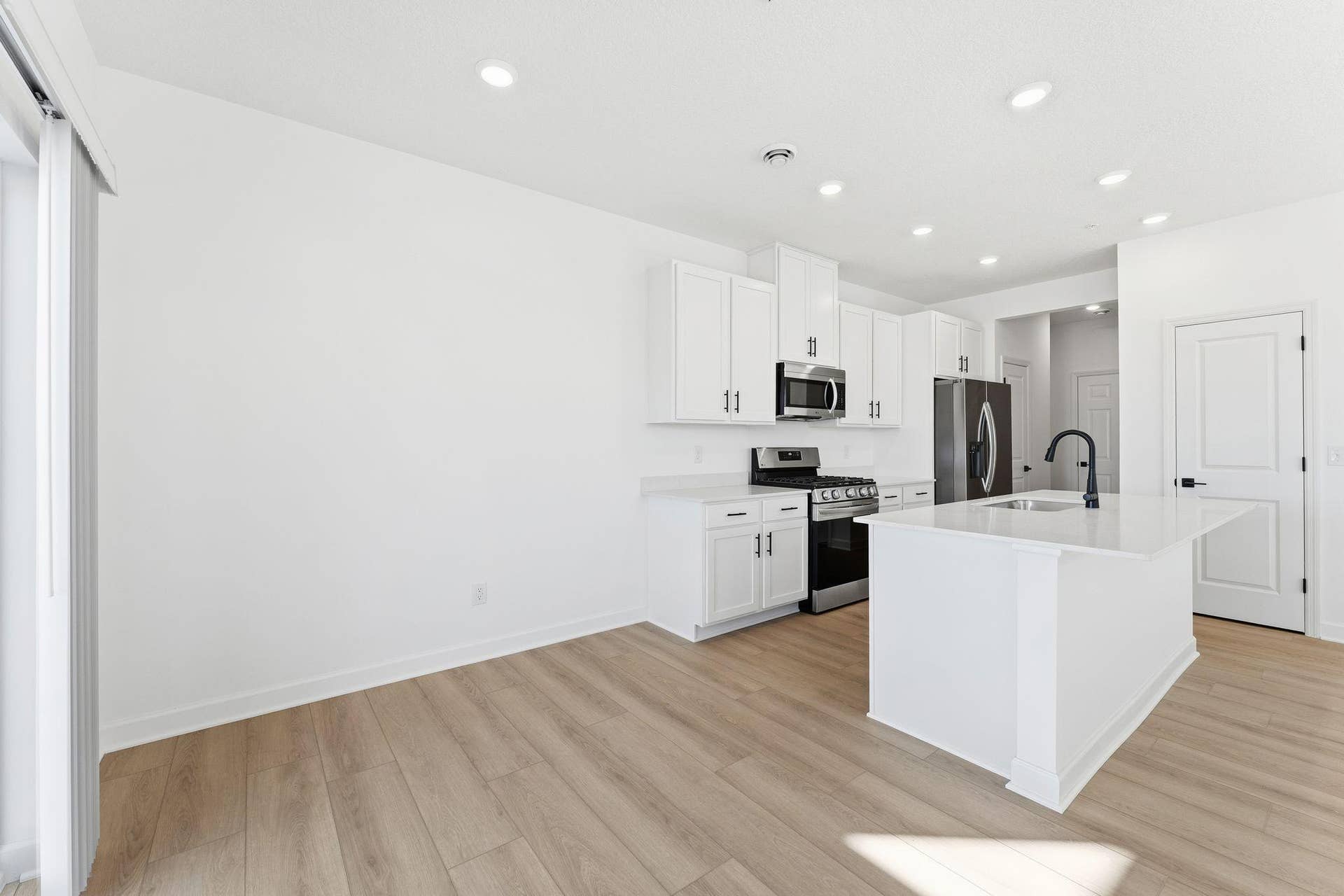 10551 Harbor Lane N, Maple Grove, MN 55369 (Photo of a similar home, actual finishes may vary) Sharing a convenient layout with the kitchen, the dining room makes it a breeze to serve piping-hot meals straight off the stove and host delicious meals of all sizes on the dinner table.