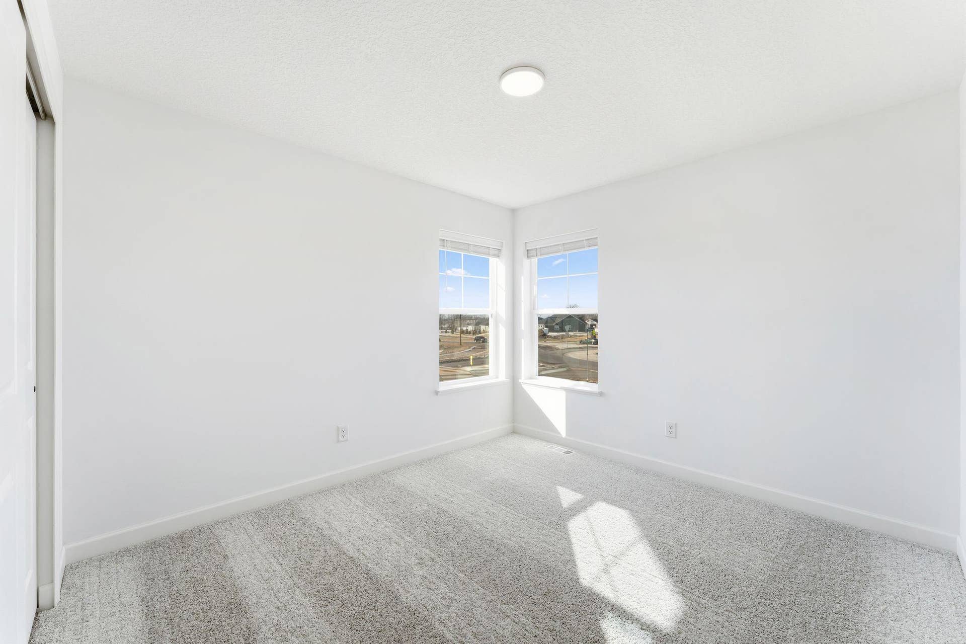 10551 Harbor Lane N, Maple Grove, MN 55369 (Photo of a similar home, actual finishes may vary) The upper-level secondary bedrooms are perfectly situated away from the downstairs main living areas and are blank canvases ready to be personalized.