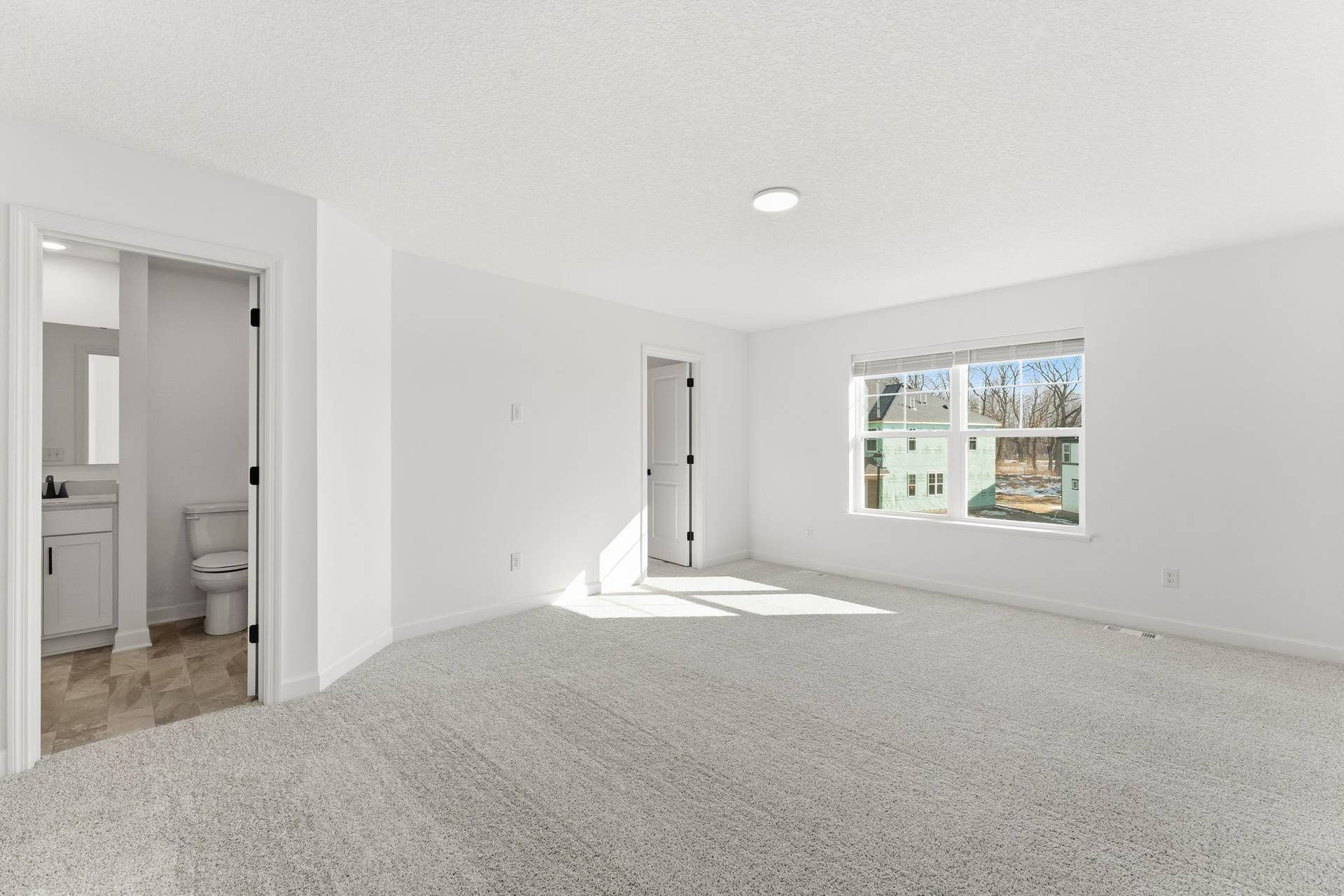 10551 Harbor Lane N, Maple Grove, MN 55369 (Photo of a similar home, actual finishes may vNestled on the top floor, the private owners suite boasts a spacious bedroom to provide restful nights and a tranquil haven for relaxation, complemented by an en-suite bathroom and large walk-in closet.