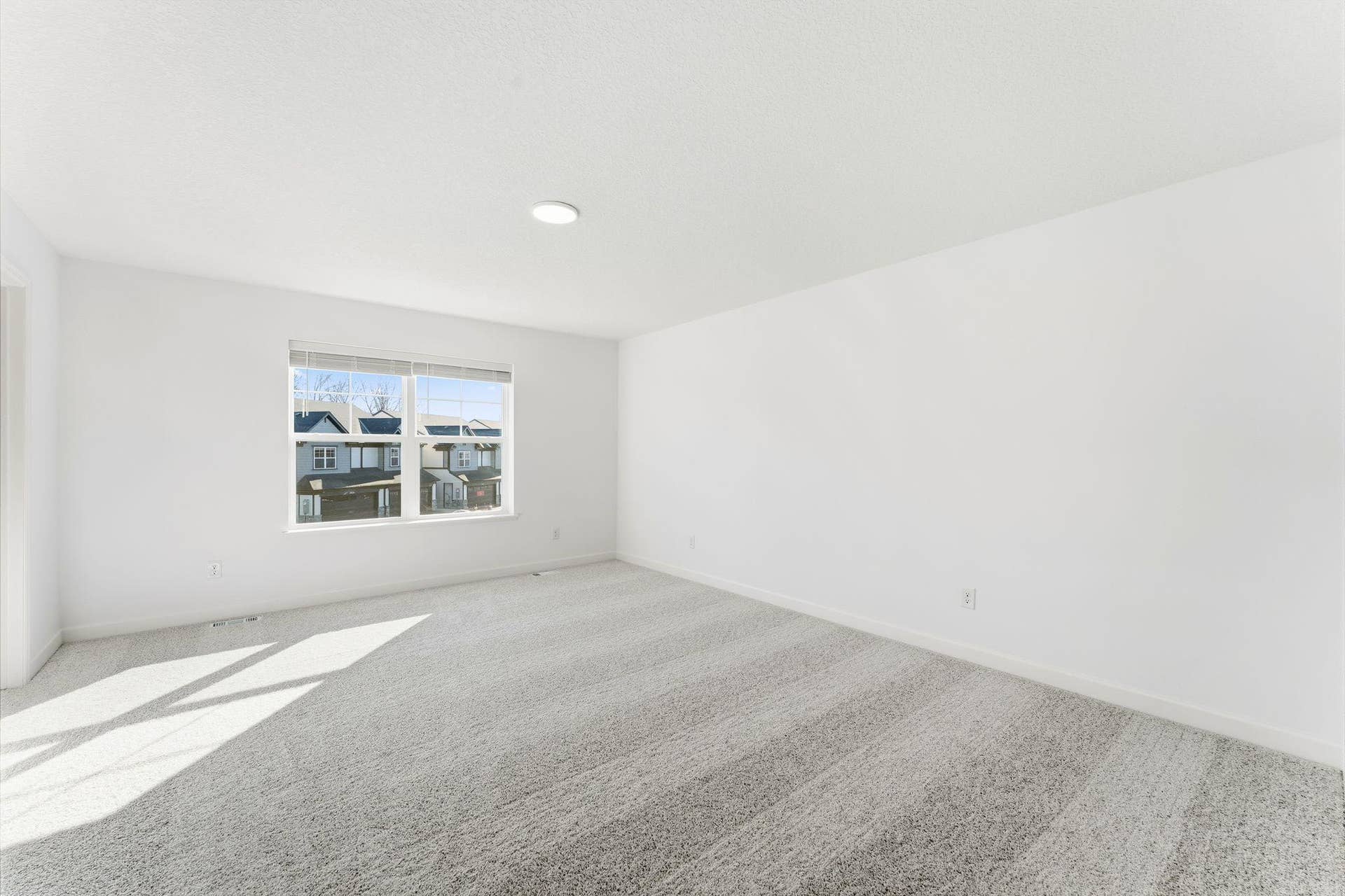 10551 Harbor Lane N, Maple Grove, MN 55369 (Photo of a similar home, actual finishes may vary) Abundant natural light streams in from the large windows