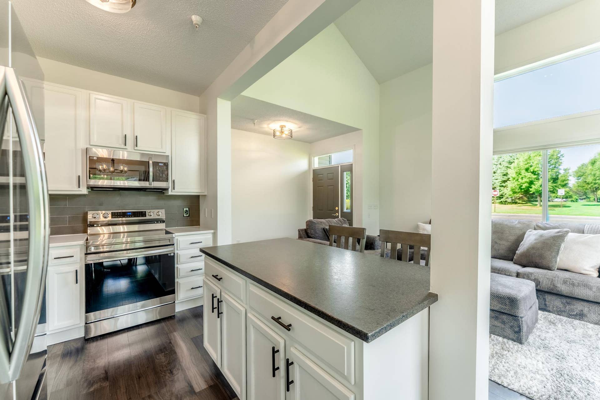 Another view of the kitchen, open to the living room.