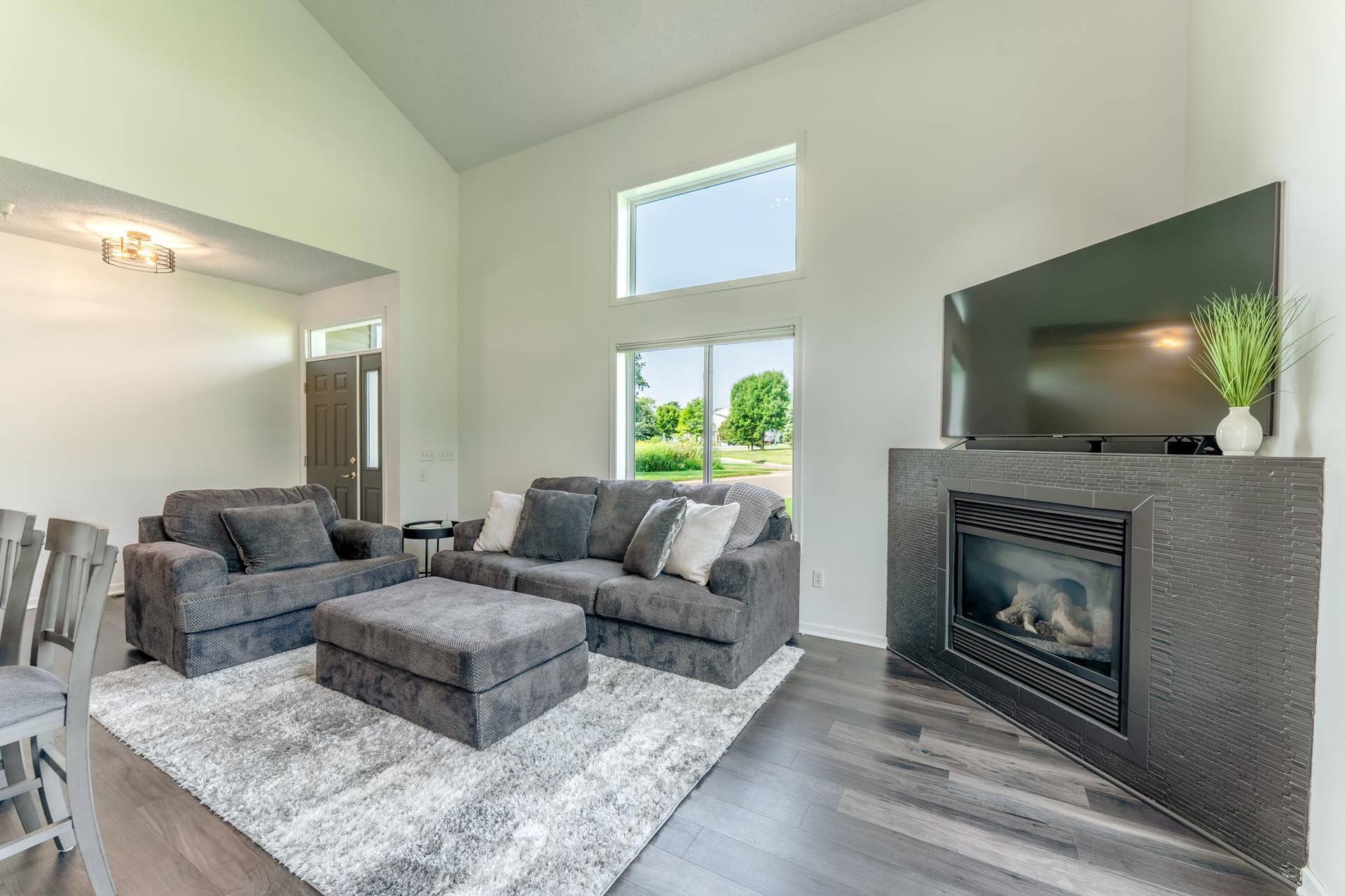 Living room is bright but has a gas fireplace keep things cozy when the weather turns cool.