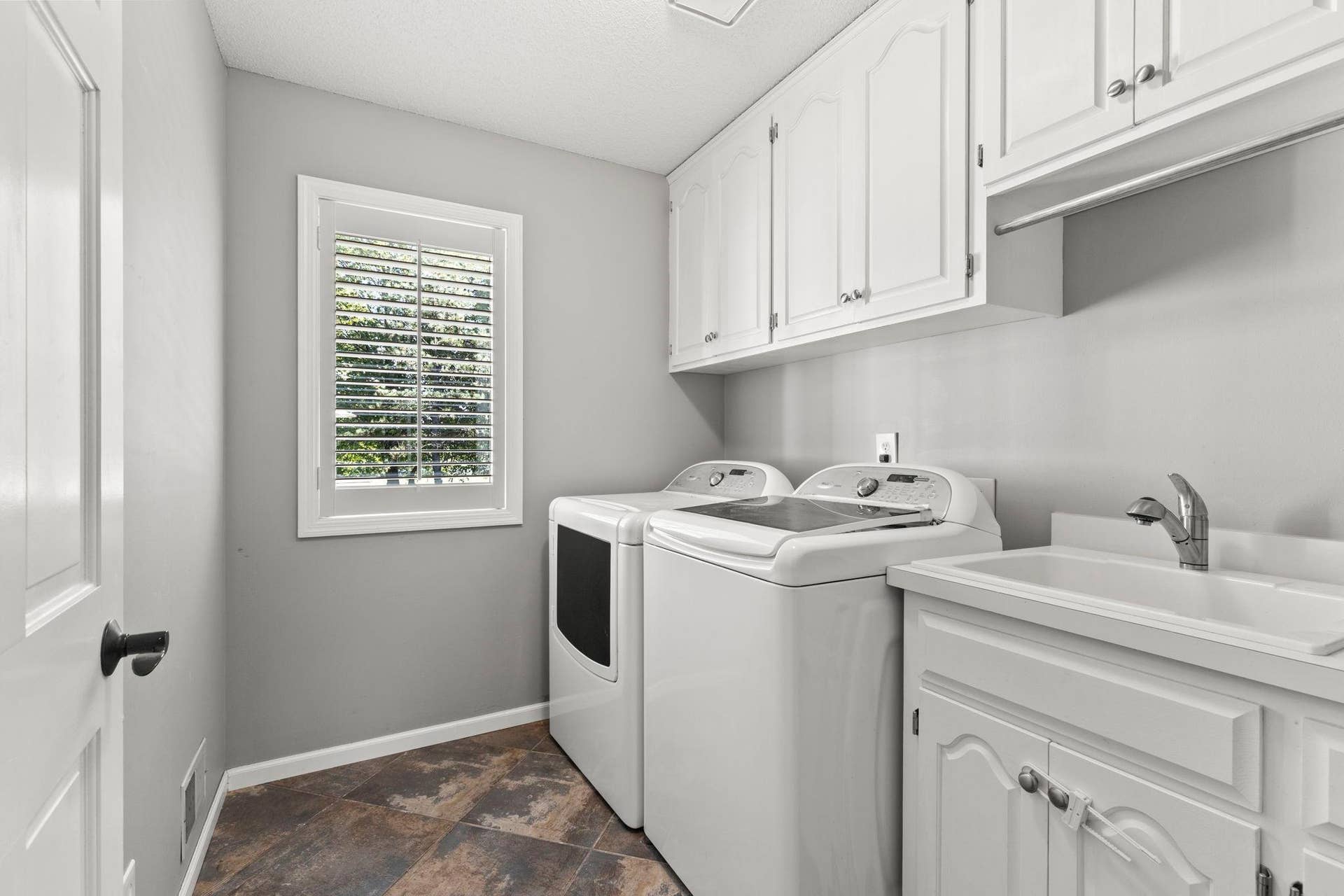 3563 Rae Lane, Woodbury, MN 55125 Main floor laundry with tub and storage