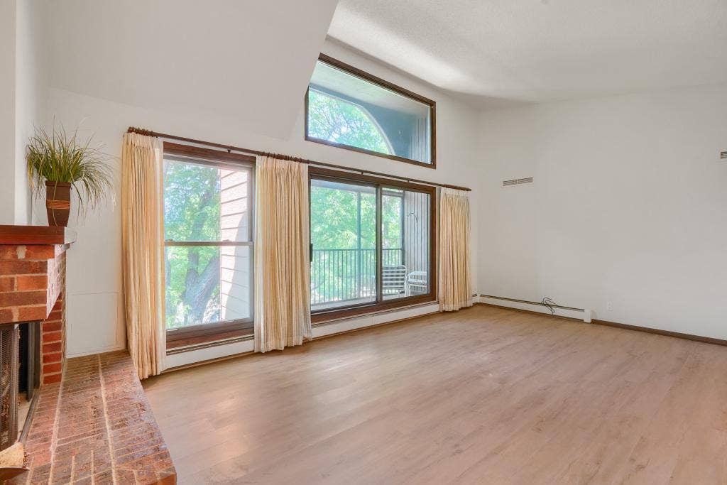 9600 Portland Avenue S, #317, Bloomington, MN 55420 Airy and bright living room with new flooring, fresh paint and tons of light! Move in ready home!