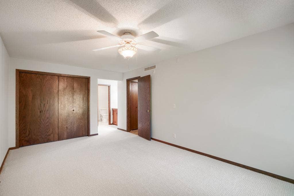9600 Portland Avenue S, #317, Bloomington, MN 55420 Primary bedroom with views into vanity and bathroom area