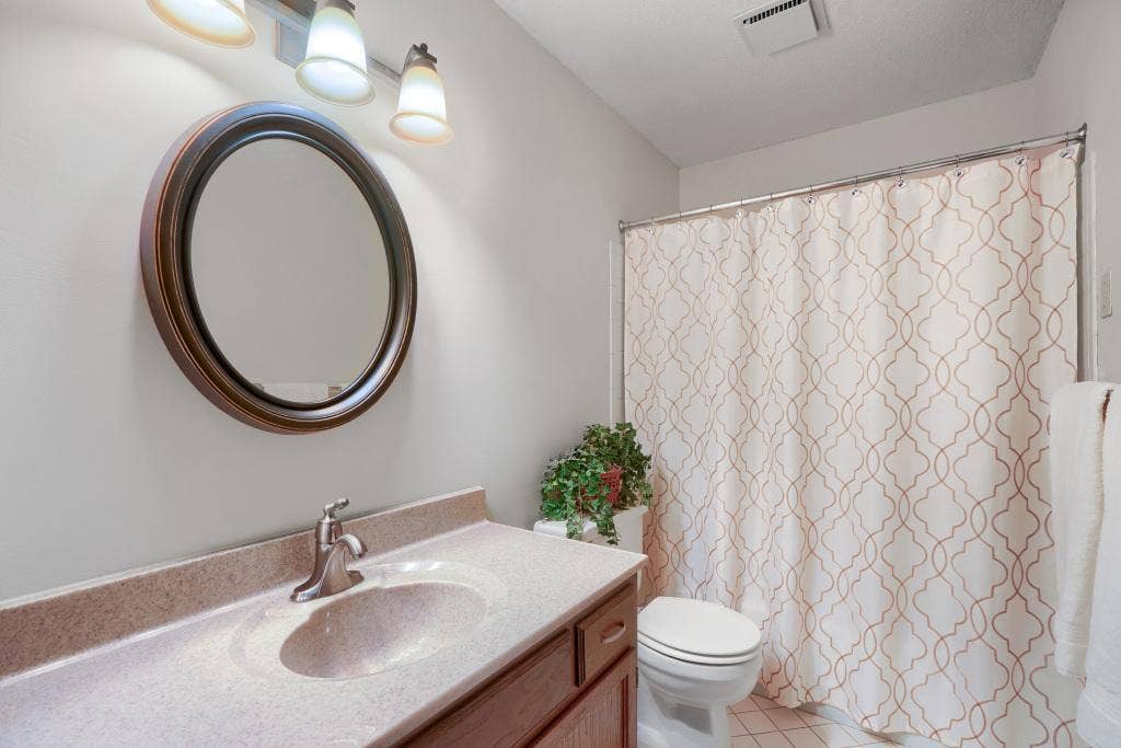 9600 Portland Avenue S, #317, Bloomington, MN 55420 Full bathroom with nice vanity and tile flooring. Home is in immaculate condition.