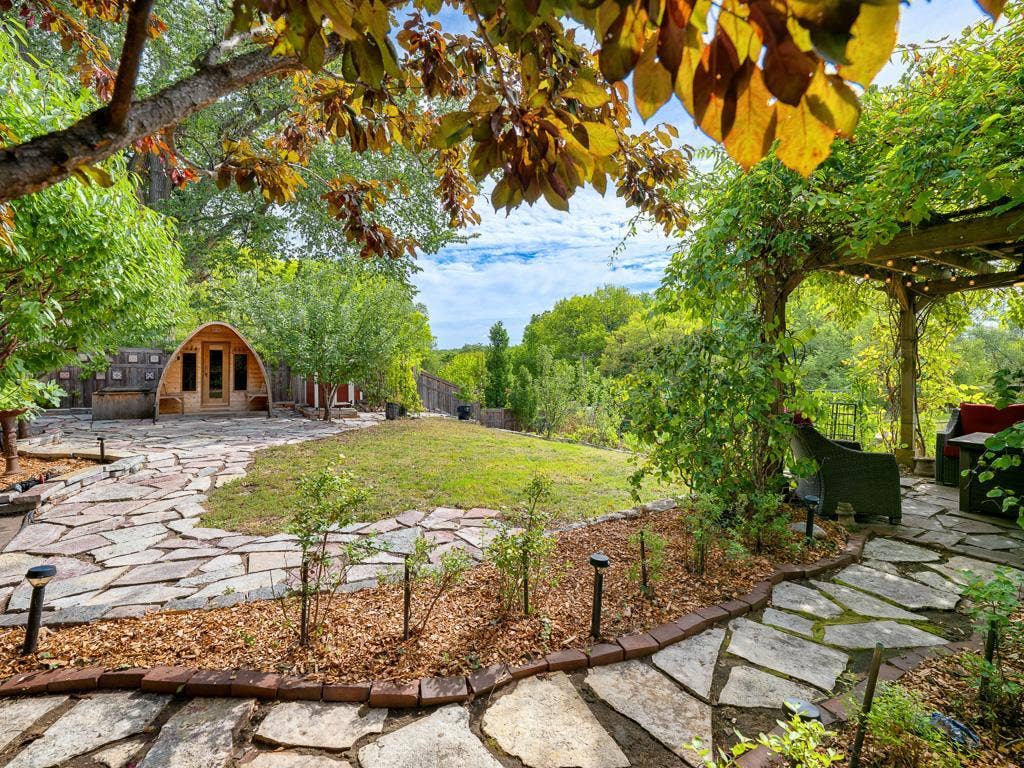 754 Linwood Avenue, 100, Saint Paul, MN 55105 10 - Backyard. A beautiful stone patio leads to a custom 6 person sauna, hot tub and cold plunge.