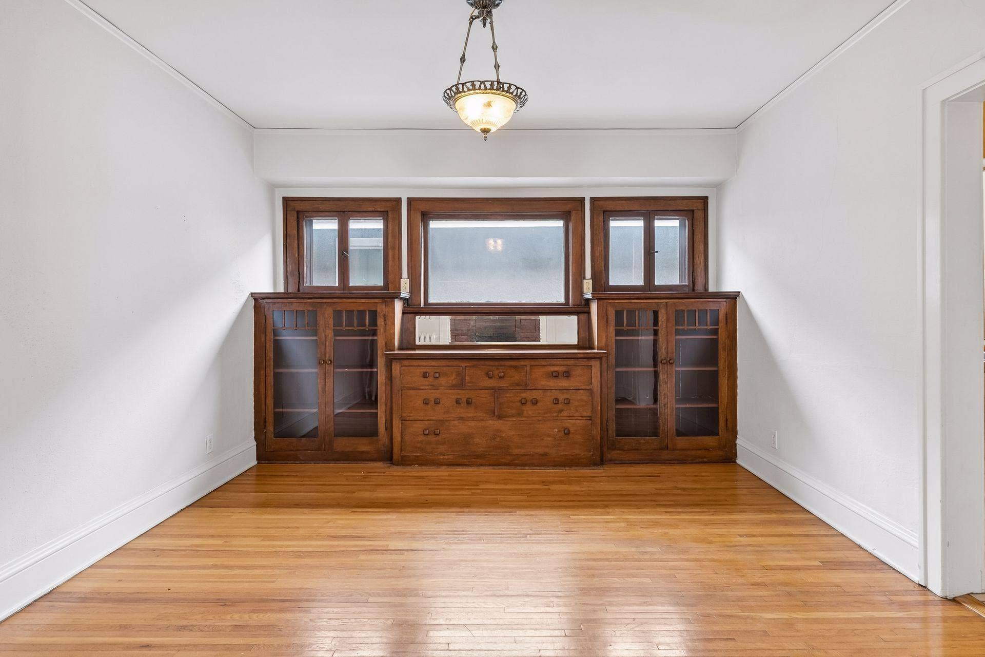 Original dining room built in buffet and bookcases