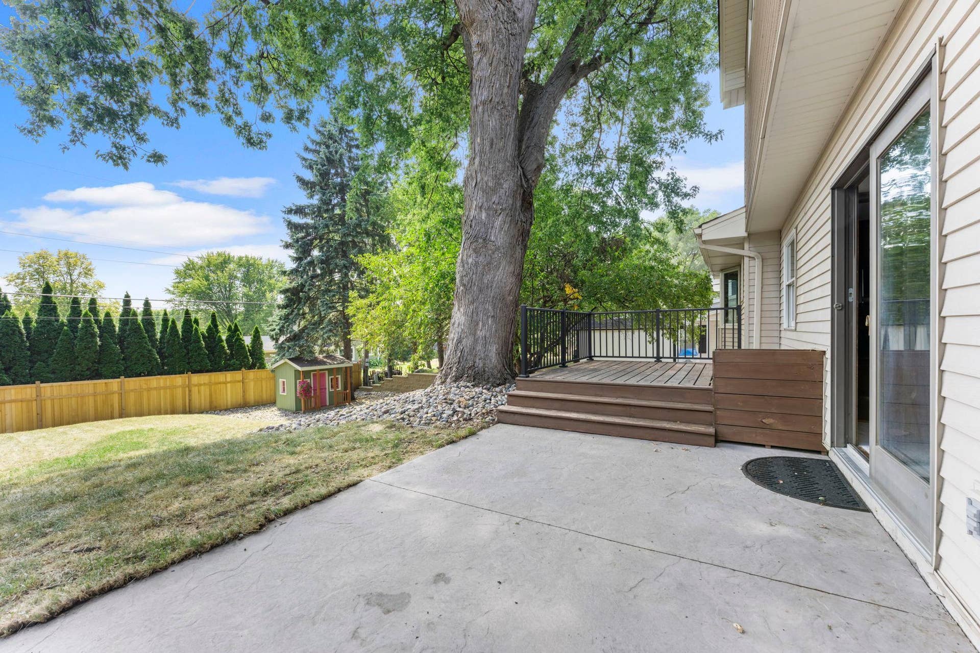 7181 Steepleview Road, Woodbury, MN 55125 The concrete patio is the perfect place to sit and soak in the private backyard.
