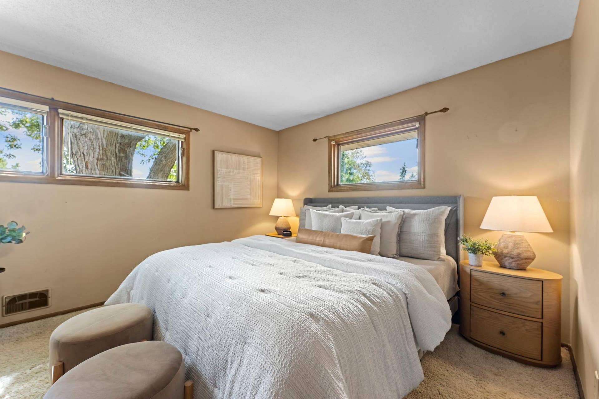 7181 Steepleview Road, Woodbury, MN 55125 The primary bedroom has windows on two sides with the larger ones looking out to the backyard.