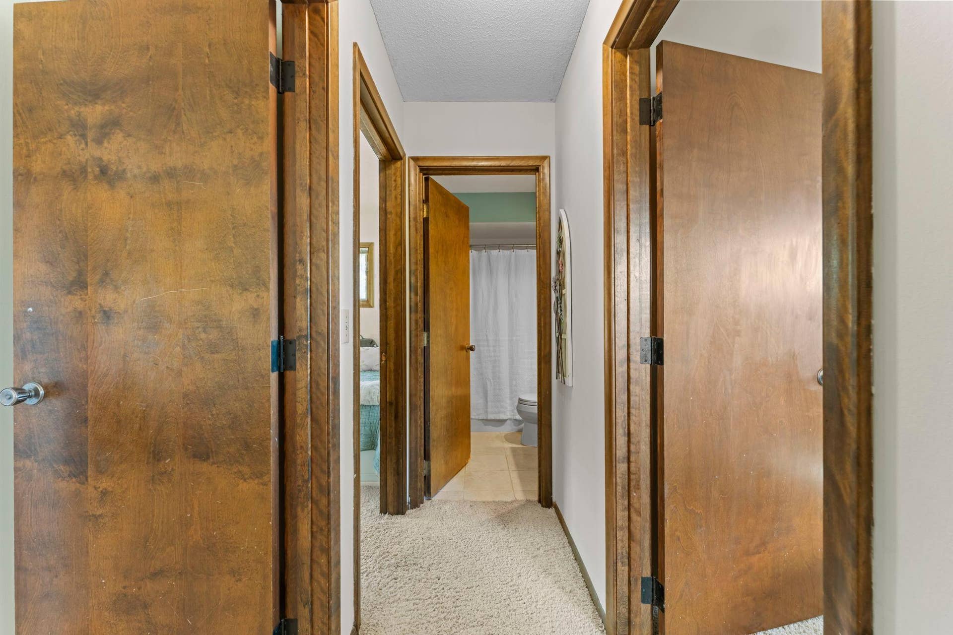 7181 Steepleview Road, Woodbury, MN 55125 Heading upstairs, you will find 3 bedrooms and two bathrooms along with the natural woodwork matching the main level.